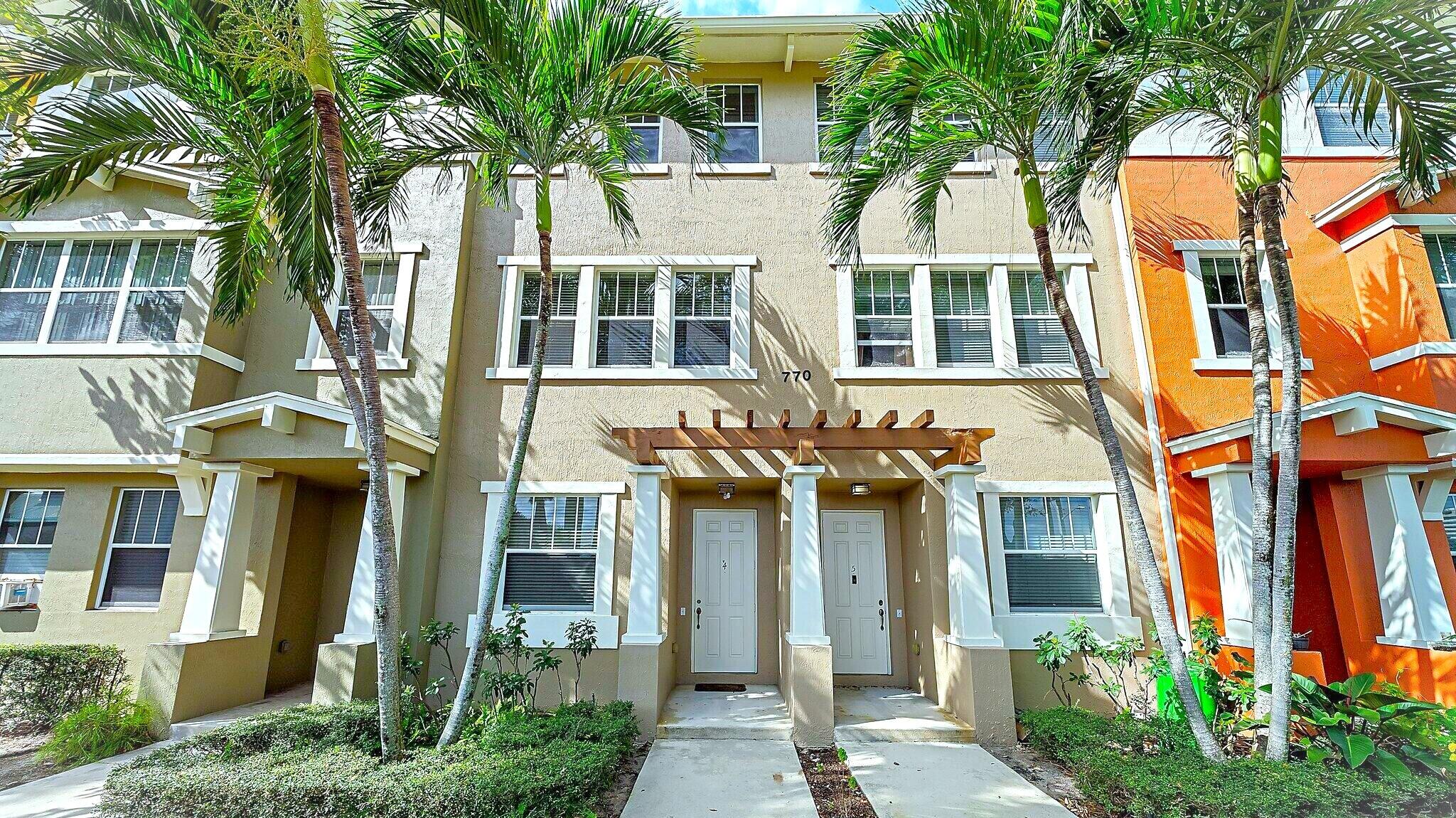Steps from the pool, clubhouse and gym, this 2 bedroom 2.5 bath with downstairs office is sure to delight.  High ceilings, plenty of natural light, and neutral tones throughout.  Stainless steel appliances and granite countertops in the kitchen.  Attached garage and driveway.  Great location in a gated community near downtown West Palm.  Only 5 minutes from I-95, downtown WPB, and the airport. Walk to Palm Beach Outlets shopping, restaurants, Target and Whole Foods. Community Amenities: 24hr manned gate security w/ nightly roving patrol, state of the art gym and clubhouse, beautiful lakeside jogging path, HUGE lakeside pool w/ covered BBQ area. Rent Includes: HD cable & internet service, water, and trash removal.  Easy to show.  Move-in ready.