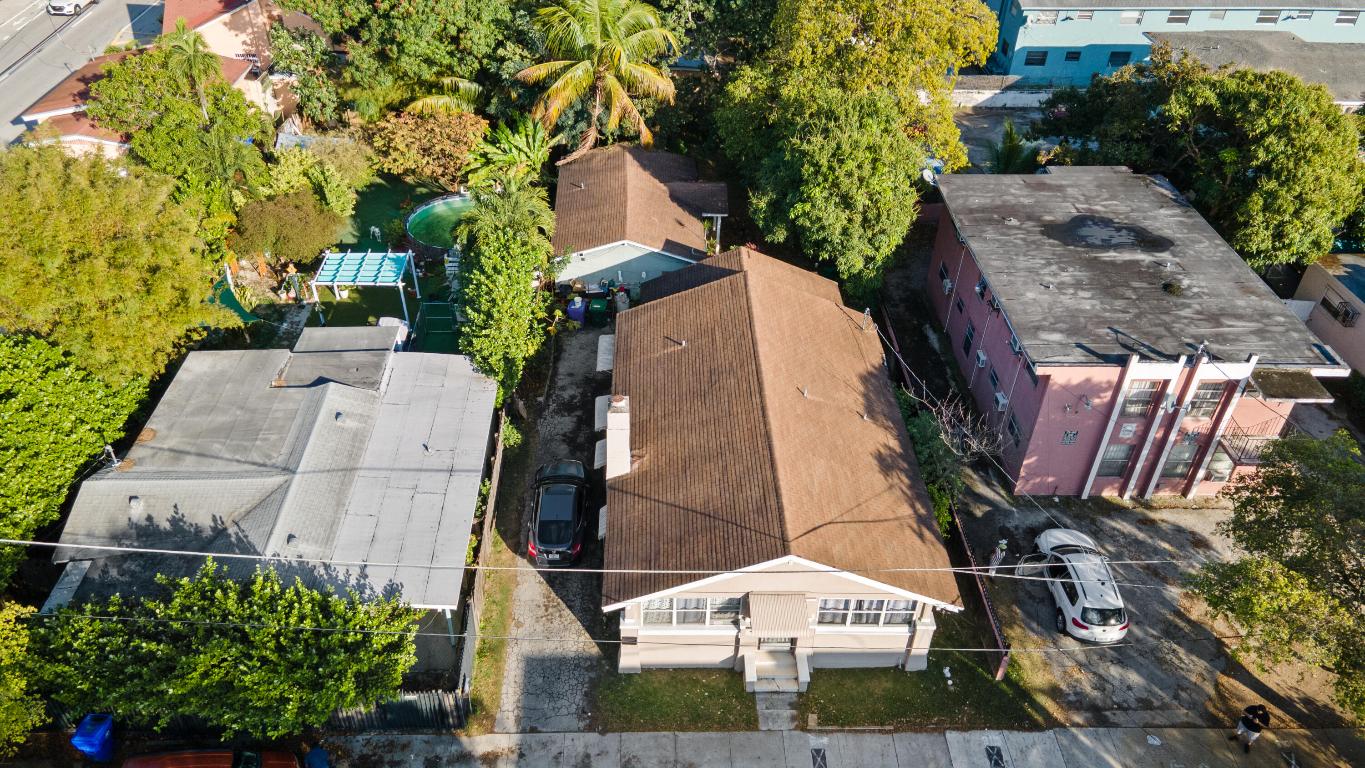 Income-producing duplex located in the heart of Miami. The property consists of a main residence with 5 bedrooms and 2 bathrooms, and a detached unit with 2 bedroom and 1 bathroom. Both units are tenant occupied on month-to-month leases. No HOA.  Property requires repairs and general TLC. Roof on the main house may need replacement. Buyer to verify condition, zoning, and use. Ideal opportunity for investors or owner-occupants.