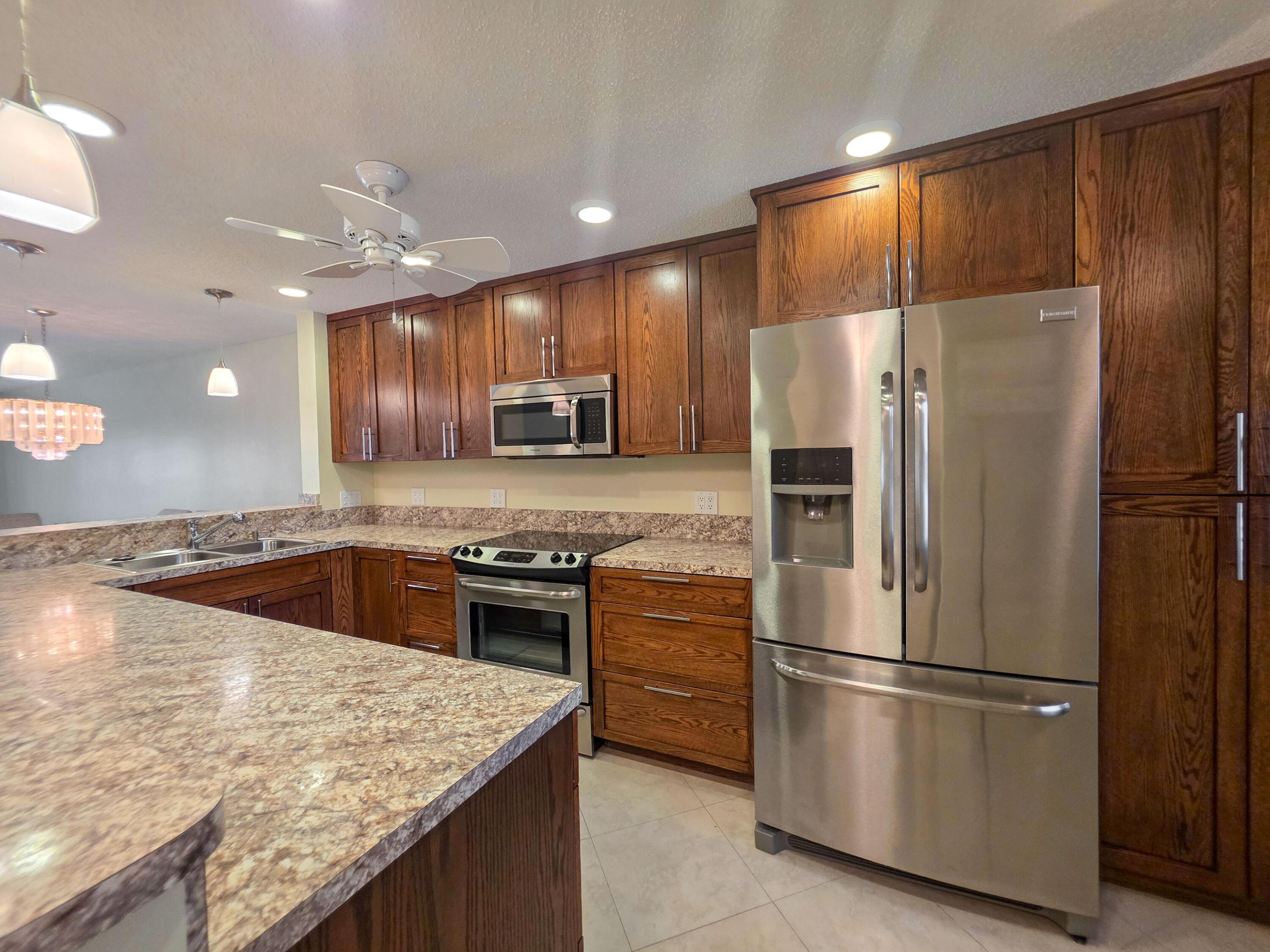 Welcome home to this beautiful ground-floor 2-bedroom, 2-bathroom condo at 7892 Willow Spring Drive #1511 in Lake Worth! This move-in ready gem features an updated kitchen and master bathroom, offering modern style and convenience. Enjoy the easy maintenance and clean look of tile flooring that flows seamlessly throughout the entire condo, as well as the added convenience of an in-unit washer and dryer. Relax and take in the serene lake views from your private, enclosed balcony. Don't miss this opportunity to own a wonderful property in a great location!