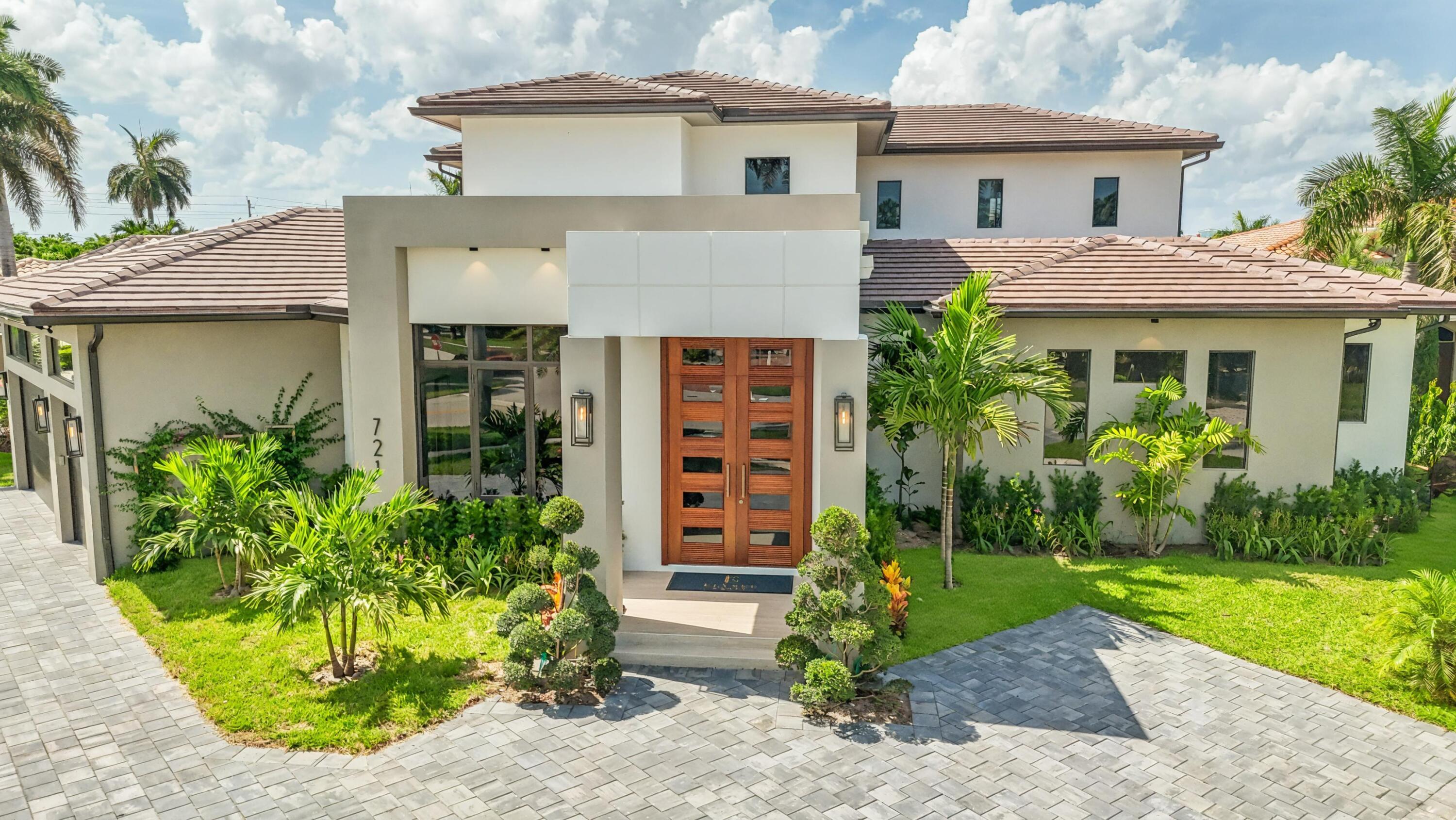 Bring your yacht and stroll to the beach as you experience the ultimate in luxury living at this brand-new waterfront masterpiece. This newly constructed coastal estate offers 5 bedrooms, 5.5 baths, and an expansive resort-style pool deck complete with a private pool, spa, and summer kitchen, perfect for year-round entertaining. The main level features a stunning primary suite designed as a serene retreat with breathtaking water views. A versatile office or den doubles as a fifth bedroom to suit your lifestyle needs. Expertly crafted by Elysee Homes, one of Boca Raton's premier custom builders, this home epitomizes modern elegance and the very best of Boca Raton's luxury waterfront living.