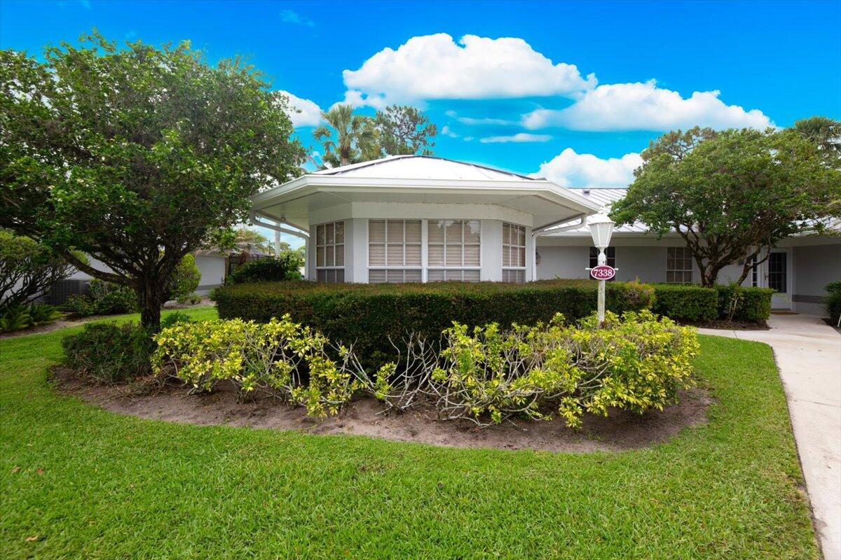 Great opportunity to own a one-story, true 3-bedroom villa in beautiful, highly desired PGA Village. Corner unit ON THE LAKE, is light and bright. Spacious living room features 2 sets of sliders for outside access. Relax on your gorgeous, travertine tile back patio overlooking the lake. Patio has stunning wood ceiling detail with skylight, sliding windows and screens. Large Primary Bedroom has patio access and ensuite bath with dual sinks. Detached garage has space for your car AND your golf cart. Pine Creek has its own private community pool, PLUS access to THE ISLAND CLUB, with lap-pool, pickleball, tennis...too many amenities to list! Surrounded by lovely, private neighborhoods, yet just minutes away from restaurants, shopping and St Lucie Mets Stadium events.