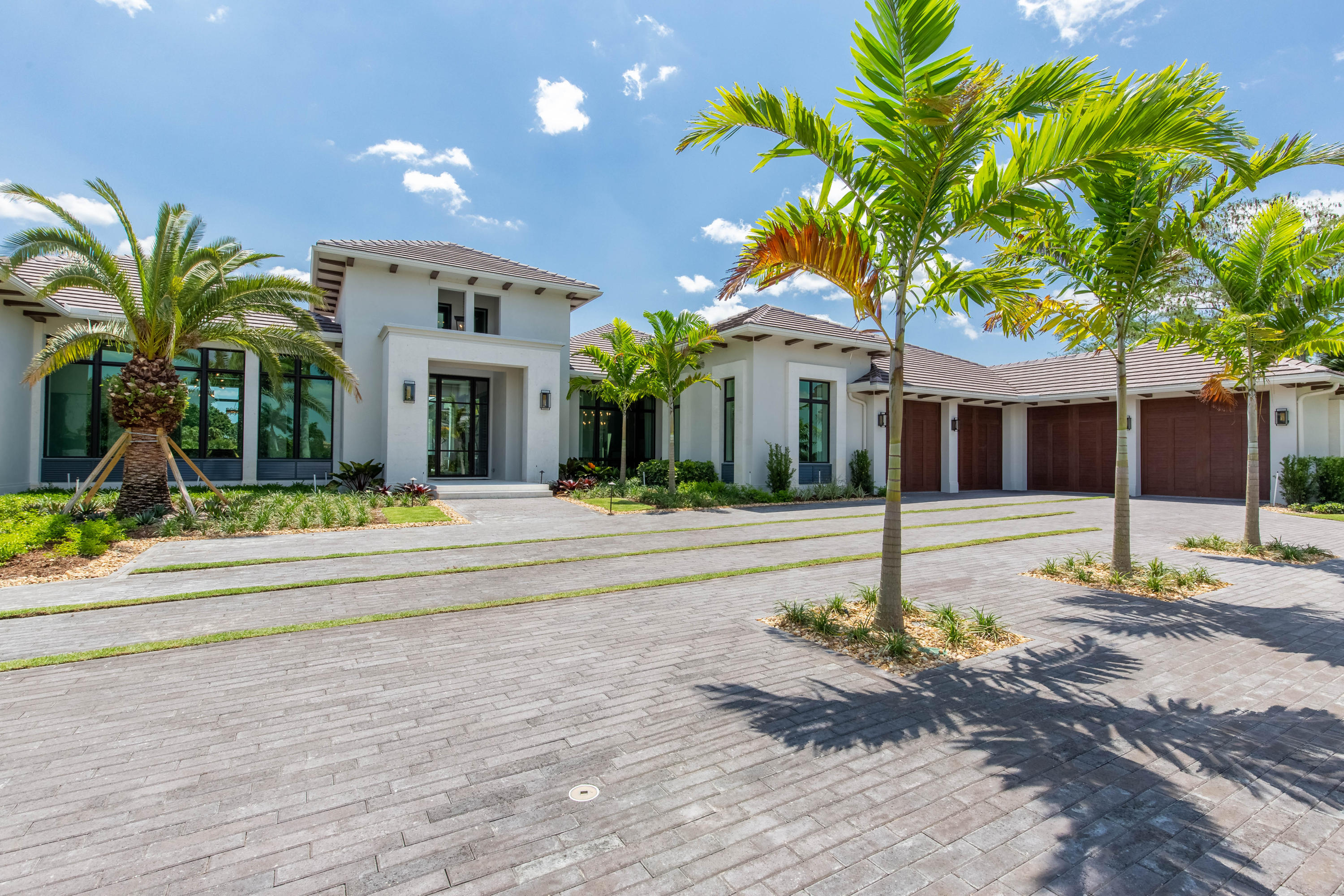 Combining timeless profiles with contemporary designs, this brand new custom home boasts 5 bedrooms, 5 full and 2 half bathrooms, a 4 car garage, and over 6,000 square feet of living space. This home is promised to accommodate your lavish lifestyle, presenting stunning views of the lake and the championship golf-course. Encompassing the main living area is a chef's kitchen with a butler's pantry and wine room, a great room, and game room with a bar. The split floor plan features a VIP suite and 3 guest bedroom's, each having private bathrooms and walk-in closets as well as a luxurious master suite with his and hers walk-in closets, a private office, as well as a sitting room. Each room is rich in architectural details, engaging a medley of raw and polished finishings, pleasing neutral colors, and wood-clad ceilings to masterfully fuse elements of farmhouse charm and modern minimalism.