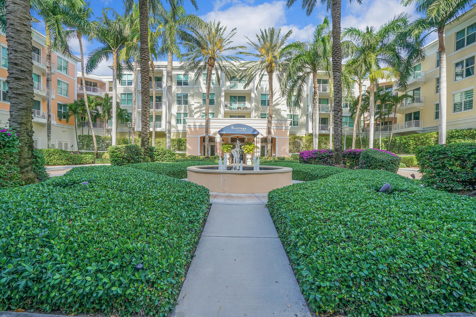 The Moorings is an intracoastal community that offers an unparalleled lifestyle with a tropical resort feel. Spend the day lounging by the pool, play a round of billiards, take a stroll along the marina, or enjoy a workout in the fitness center. Assigned garage parking, 24-hour security, valet parking, fitness center with saunas, two pools, two spas, billiards room, club room, and business center are all available for you to enjoy. For the boating enthusiast, boat slips may be available at the marina. The condo itself is a masterpiece of design offered fully furnished with an open floor plan that makes entertaining a breeze. The kitchen is a chef's dream with stainless steel appliances, granite countertops, and plenty of cabinet space Both master bedrooms are spacious and comfortable with walk-in closets that provide ample storage. Impact windows enhance the aesthetic appeal of the condo and provide security and protection. Freshly painted interior, laminate wood flooring throughout, and crown molding are just a few features that make this unit feel like home. The condo provides peace of mind with a new dishwasher (2023), new Trane A/C (2022), and new Rheem hot water heater (2022).  Perhaps the best part of this condo is its location. It's just minutes from PBI, world-class shopping, fine dining, amazing beaches, and golf courses. Major highways, public transportation, and the Brightline are easily accessible making it a convenient base for exploring the city and beyond.  Don't miss out on this incredible opportunity to make this beautiful condo at The Moorings your new home today. Schedule your private showing today!
