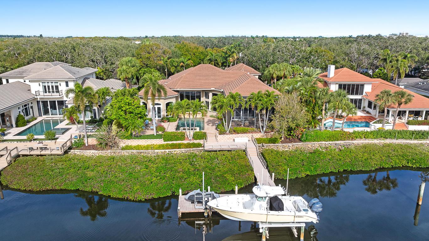 Discover the epitome of luxury living in this stunning 4-bedroom estate, perfectly situated in the prestigious Admirals Cove community. This exquisite home offers an unparalleled blend of elegance and comfort, featuring a spacious and inviting floor plan designed for both entertaining and everyday living. The open layout seamlessly connects the living, dining, and kitchen areas. Enjoy the ultimate relaxation with a private pool and spa, perfect for unwinding after a long day. Just a short stroll to The Club, you can indulge in world-class amenities and social activities. The roof was replaced in 2018, ensuring peace of mind and longevity. Bask in the natural light that floods the home, complemented by lush tropical landscaping that creates a serene oasis. The screened-in outdoor living room offers a perfect space for al fresco dining and entertaining, protected from the elements. With a dock that accommodates a large boat, you can easily explore the beautiful waterways right from your backyard. Experience the best of waterfront living in this exceptional Admirals Cove estate. Schedule your private tour today and make this dream home yours!