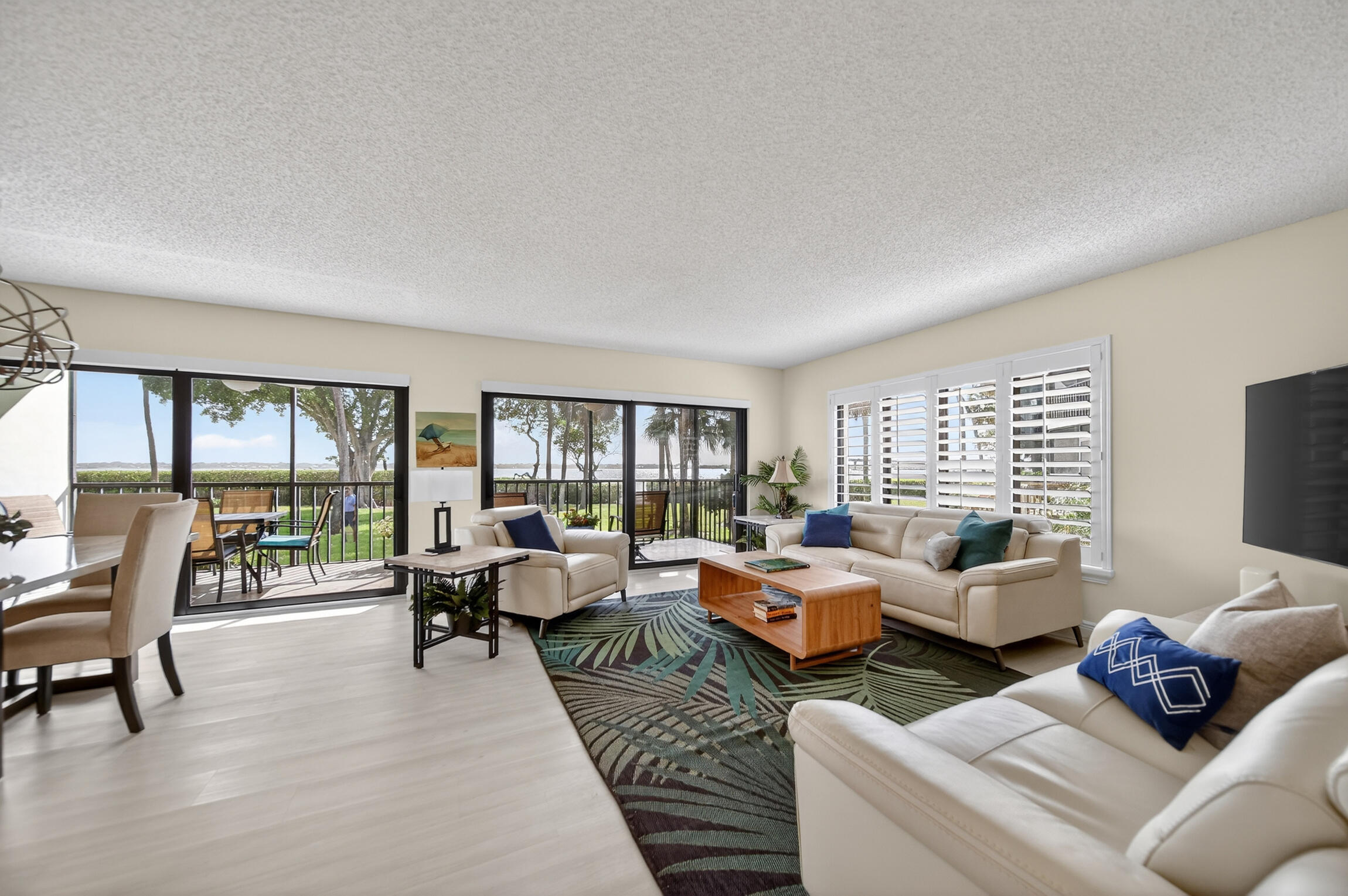 Panoramic Waterfront Living at Riverwood IRP. Experience breathtaking wide-water Intracoastal views from this beautifully updated first-floor corner condo. This light-filled residence offers a spacious open floor plan, with sliding glass doors leading to a screened porch ideal to enjoy sunsets. Thoughtfully renovated, this home features full-impact windows and plantation shutters, a modern kitchen with quartz countertops, custom cabinetry, and new Cafe appliances, new LVP flooring throughout, new w/d, 2025 A/C, motorized blinds on sliders. Step directly from your screened porch to private kayak storage and launch! Condo is available for annual rent. Condo is also available FOR SALE with potential Owner financing.