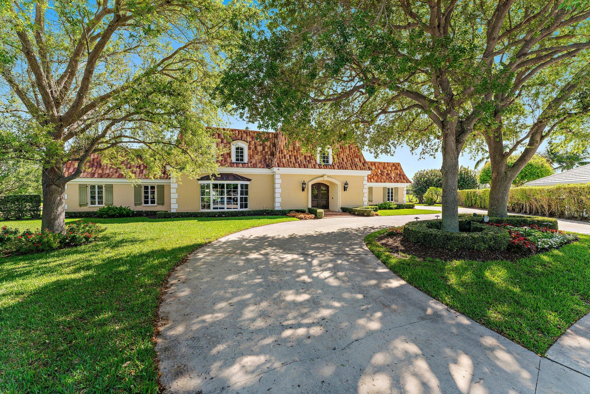 Unprecedented, once in a generation, opportunity awaits in this stately French Country estate home, perfectly positioned on one of the largest Jack Nicklaus Signature golf course and lakefront lots in the entire Village of North Palm Beach, a short walk or golf cart ride to the clubhouse! Situated on over half an acre and tucked away towards a quiet cul-de-sac, unparalleled grounds and endless views across four fairways to intracoastal boating activity await from every angle. Architecturally stunning and thoughtfully laid out over approximately 5,197 square feet of living space. Beyond the natural stone foyer with power room, hidden storage, and sweeping spiral staircase, voluminous ceilings await as you entertain in the formal living room or formal dining room area finished in beautiful hardwood floors, overlooking the expansive green space, pool, lakes, and golf course beyond. In the heart of the lower level the kitchen boasts warm wood cabinetry with pantry, pass-through to the Florida room with incredible natural light and terra cotta floors, and opens to the adjacent den with eat-in dining area featuring uniquely orchestrated garden, pool, lake, and golf course views. Retreat to the first-floor Primary suite, with en-suite bath and walk-in closet, leading to the Florida room with tranquil sunrise to sunset views. Guest accommodations, across the split-floor plan of the main level, feature an additional bedroom with golf course view and adjacent full cabana bath leading to the pool. Upstairs an office/study and bonus room open to an upper deck area with panoramic views, and two additional bedrooms, with en-suite baths. Endless outdoor entertainment awaits on the spacious private patio, all backlit with lush, tropical landscaping and overlooking the pool, lakes, and golf course. Secluded cul-de-sac entrance leads to an expansive circular driveway, with abundant guest parking and full two-car garage. Upgrades abound : all impact windows and doors, newer air conditioning systems, landscape lighting, and more.

Enjoy all that desirable, membership-optional North Palm Beach has to offer : new clubhouse, The Clubhouse restaurant and bar, redesigned Jack Nicklaus Signature golf, driving range, tennis center, Olympic-sized swimming pool with splash play area, private boat ramp, marina, playgrounds, parks, organized activities, all minutes from the area's best education, dining, shopping, and Palm Beach International Airport.