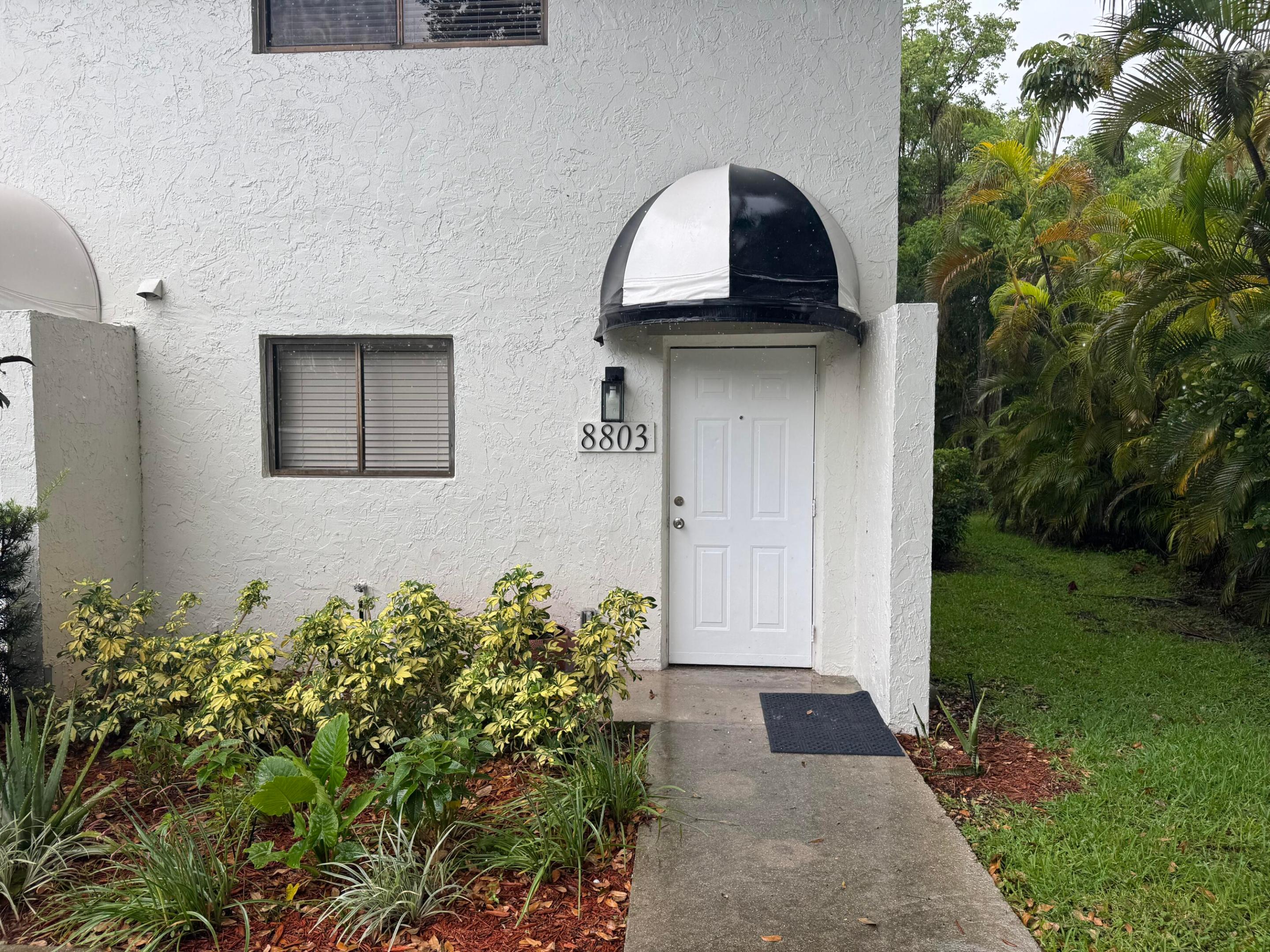 End unit. Spacious living area with sliding door overlooking patio in the backyard. Washer and dryer in unit.   Newly installed carpet in bedrooms. Each bedroom features its own ensuite full bathroom and closet space.  Limited to two parking spaces - no commercial vehicles. No HOA.   No pets. $2,000 per month. Water included. Electric separate.