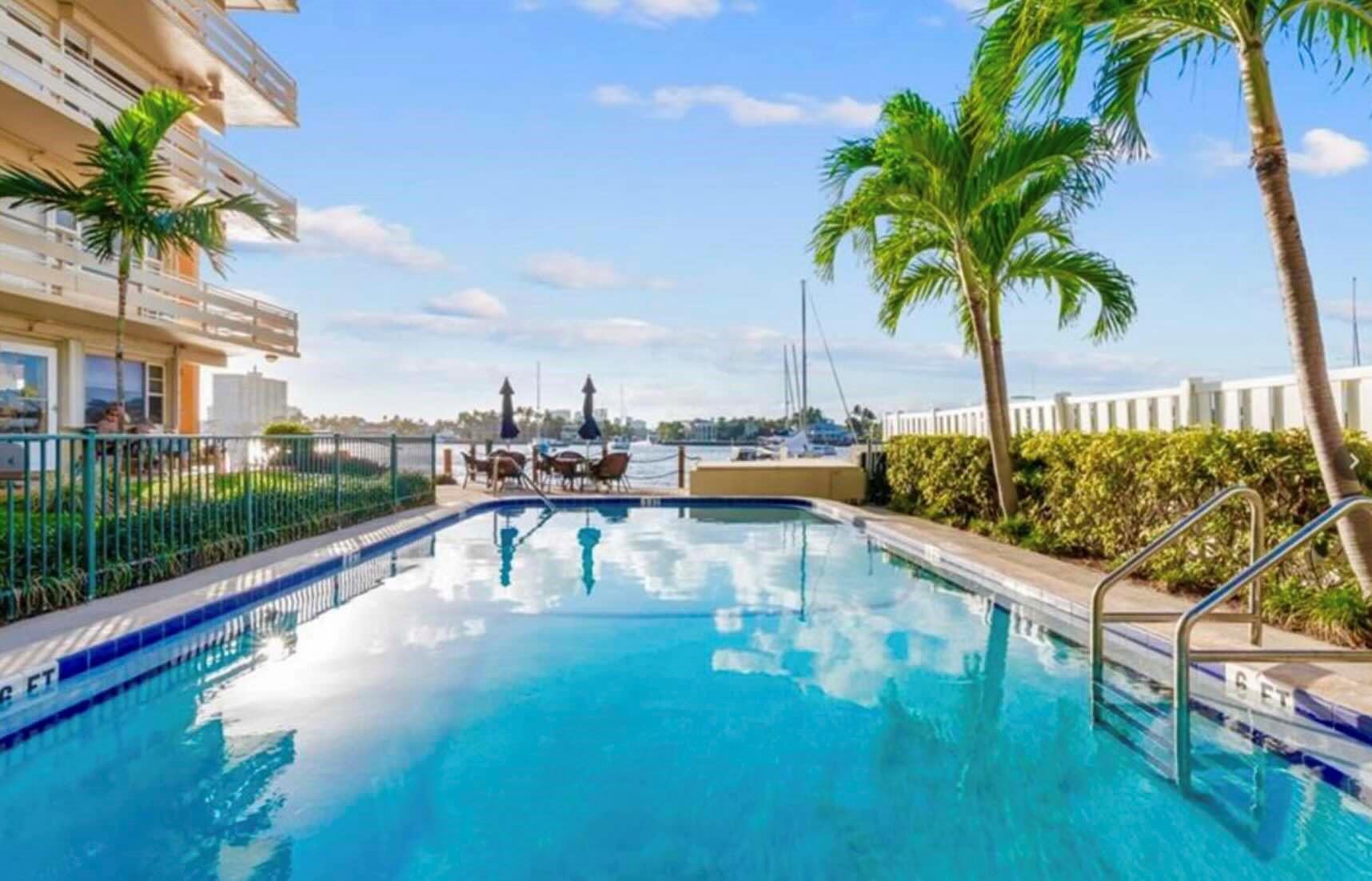 LOCATION! LOCATION! LOCATION!Contemporary Penthouse Floor Corner Condominium Annual Lease with Beach and Marina Living at itsbest. Corner unit with windows facing East, South and North overlooking ocean and Intracoastal marina. Fullyfurnished turn key all new porcelain flooring through out and updated kitchen and bath. Intracoastal front Poollocated overlooking marina and a spacious dock to sunbathe and lounge on. One Private Parking Space Included.Located behind the Ritz Carlton and just one block to the ocean. Walk to coffee shops, Ocean, multiple cafe allwithin a block. Amazing value to be in an updated modern unit with a beautiful dock below to sit on and enjoy ordip in the pool