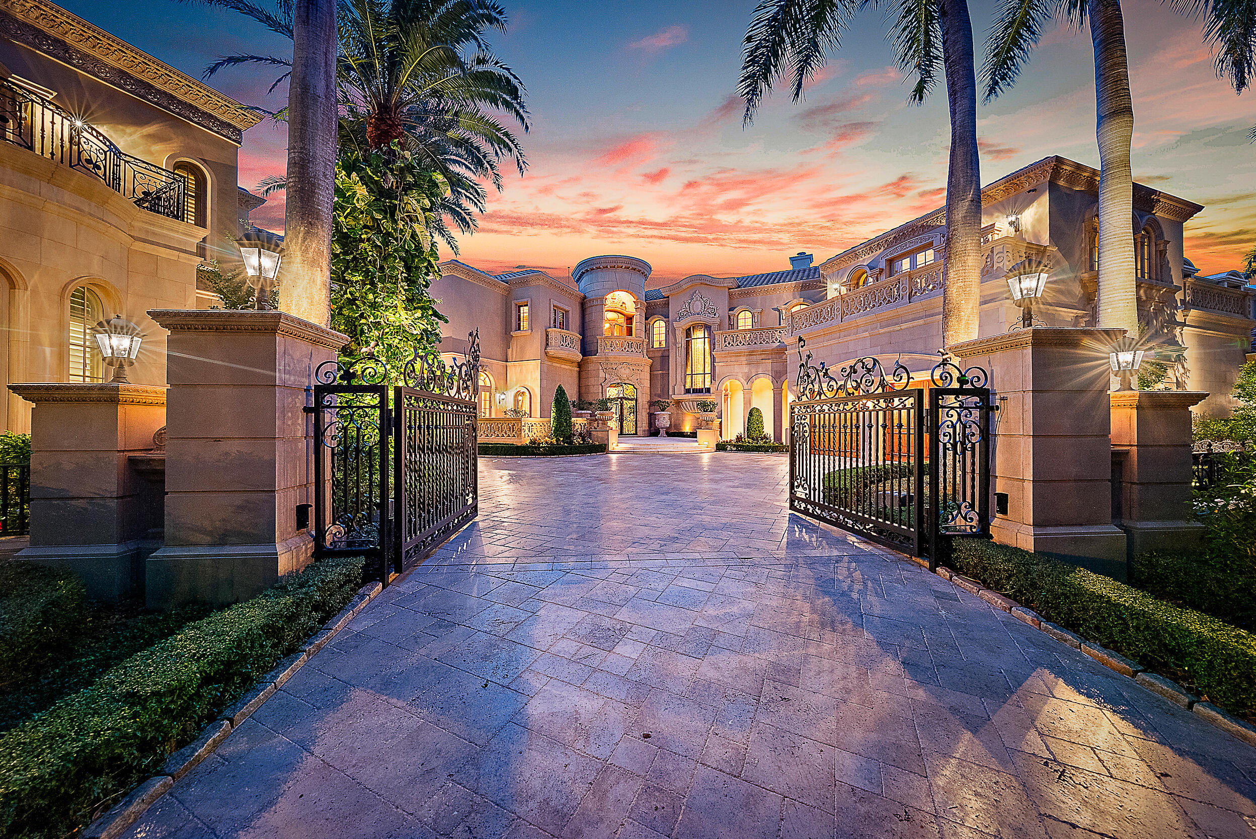 Introducing a palatial waterfront estate on a double lot in the exclusive community of Admirals Cove, where timeless design meets South Florida luxury. Situated on prime water frontage with two private docks, this architectural masterpiece offers 9 bedrooms, 13 baths, and a lifestyle defined by elegance and ease. Ideal for yacht owners and water enthusiasts, the property offers exceptional access and capacity for large vessels or multiple watercrafts. Every detail of the interior has been thoughtfully curated—from soaring ceilings and rich finishes to spacious living areas designed for both grand-scale entertaining and private retreat. . A dedicated 3-bedroom guest house ensures comfort and privacy for extended family or visitors,   SEE MORE... while the 6-car garage provides ample space for car collectors and enthusiasts. The estate is a dream for entertainers, with a complete catering kitchen and wet bar, a formal dining room fit for large gatherings, and a club room upstairs featuring warm wood finishes, multiple seating areas, custom wood walls all overlooking breathtaking Intracoastal views. Enjoy alfresco dining by the water or unwind poolside surrounded by tropical serenity. Admirals Cove is one of Jupiter's most sought-after gated communities, known for its luxurious waterfront lifestyle, 45 holes of championship golf, tennis, a world-class marina, and a private country club with five-star amenities. Located in the heart of Jupiter, FL, residents enjoy easy access to pristine beaches, top-rated schools, fine dining, and everything that makes this coastal town one of Florida's most desirable places to live.