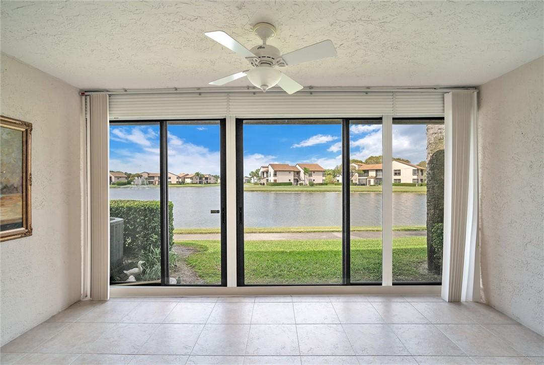 This corner unit w/extra windows provides Gorgeous lake & fountains views. Remodeled kitchen w/ STONE COUNTERTOPS, STAINLESS STEEL APPL, The covered Florida room is the perfect place for a glass of wine while enjoying the sunset. Roll down storm shutters. Inside laundry room. Split floor plan w/ Primary bedroom & office space or sitting area with stunning lake views. The unit is bright. Pet friendly community with 2 pools, hot tub, tennis courts, and clubhouse w/ gym. Central location puts you extremely close to all major Boca Raton shopping, highways, & restaurants. 10 mins from your door to the mall, 95 & 2 mins from turnpike! The building roof was just replaced in 2022, complex with full reserves that allows only 5% down for financing. Truly a rare gem! A+ Rated schools. Gated Community