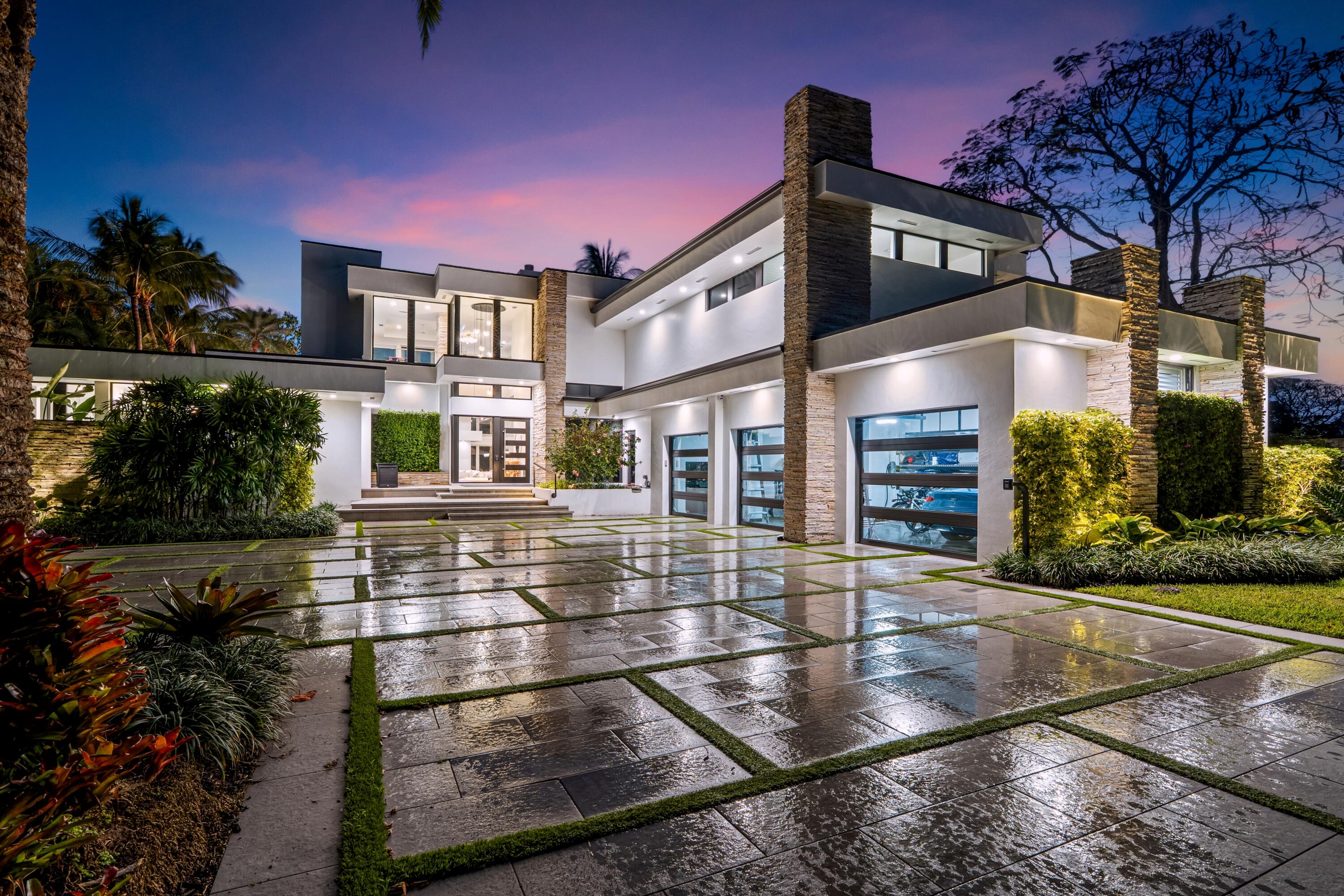 On nearly one acre with 110± feet of direct frontage on Lake Ida, this rare architectural statement estate, inspired by the timeless design philosophy of Frank Lloyd Wright, blends natural stone, warm woods, and neutral tones, creating one of the most distinctive waterfront fully remodeled offerings in Delray Beach. Designed by Randall Stofft to elicit a light-filled breezy vibe and a chic sophisticated sensibility, details of the stunning Contemporary-Mid-Century-style estate, with five bedrooms and 6,828+/- total square feet, include soaring ceilings, a complete kitchen transformation featuring custom dark cabinetry, blackened steel hood, new stone countertops and slab applications, luxury brand appliances including Sub Zero refrigerator, Wolf stacked double ovens and cooktop. Kitchen also includes Fisher and Paykel dishwasher drawers (in addition to a total of four dishwashers) and a built in Miele coffee system.  A new floating staircase with glass panels, real wood treads, and black steel detailing transforms the entry.  With a split-bedroom plan for privacy, the first-floor primary suite features floor-to-ceiling windows offering lake views. The primary suite comprises two custom-fitted closets and a spa-inspired bathroom with a custom dual vanity with under cabinet lighting and suspended mirrors.  Porcelain slabs define the shower which includes Kohler fixtures such as body sprays, handhelds, and rain shower heads, along with a nearby towel warmer.  Upstairs, the loft and morning bar access a large lake-view balcony and serve two ensuite guest bedrooms. Ideal for extended family, staff or guests, a separate guest apartment includes a bedroom and an office/bedroom opens to a sun deck. Every bathroom was fully renovated with new tile, vanities, mirrors, Kohler plumbing fixtures, lighting, and Toto toilets.  Exterior spaces were transformed and the pool and spa were fully renovated into a saltwater system with two heaters, surrounded by updated hardscape and a loggia with retractable screens.  Other details of note: Wine Cellar, whole house water filtration system, three car garage with a lift to accommodate a fourth car, a new roof was installed in 2020, and full-house generator was installed in 2021. This offering is truly a rare opportunity to own a legacy property.  DISCLAIMER: Information published or otherwise provided by the listing company and its representatives including but not limited to prices, measurements, square footages, lot sizes, calculations, statistics, and videos are deemed reliable but are not guaranteed and are subject to errors, omissions or changes without notice. All such information should be independently verified by any prospective purchaser or seller. Parties should perform their own due diligence to verify such information prior to a sale or listing. Listing company expressly disclaims any warranty or representation regarding such information. Prices published are either list price, sold price, and/or last asking price. The listing company participates in the Multiple Listing Service and IDX. The properties published as listed and sold are not necessarily exclusive to listing company and may be listed or have sold with other members of the Multiple Listing Service. Transactions where listing company represented both buyers and sellers are calculated as two sales. "No payments made until title passes" Some affiliations may not be applicable to certain geographic areas. If your property is currently listed with another broker, please disregard any solicitation for services. Information published or otherwise provided by seller, listing company or its representatives is deemed reliable but are not guaranteed and subject to errors, omissions, or changes without notice. Copyright 2026 by the listing company. All Rights Reserved.