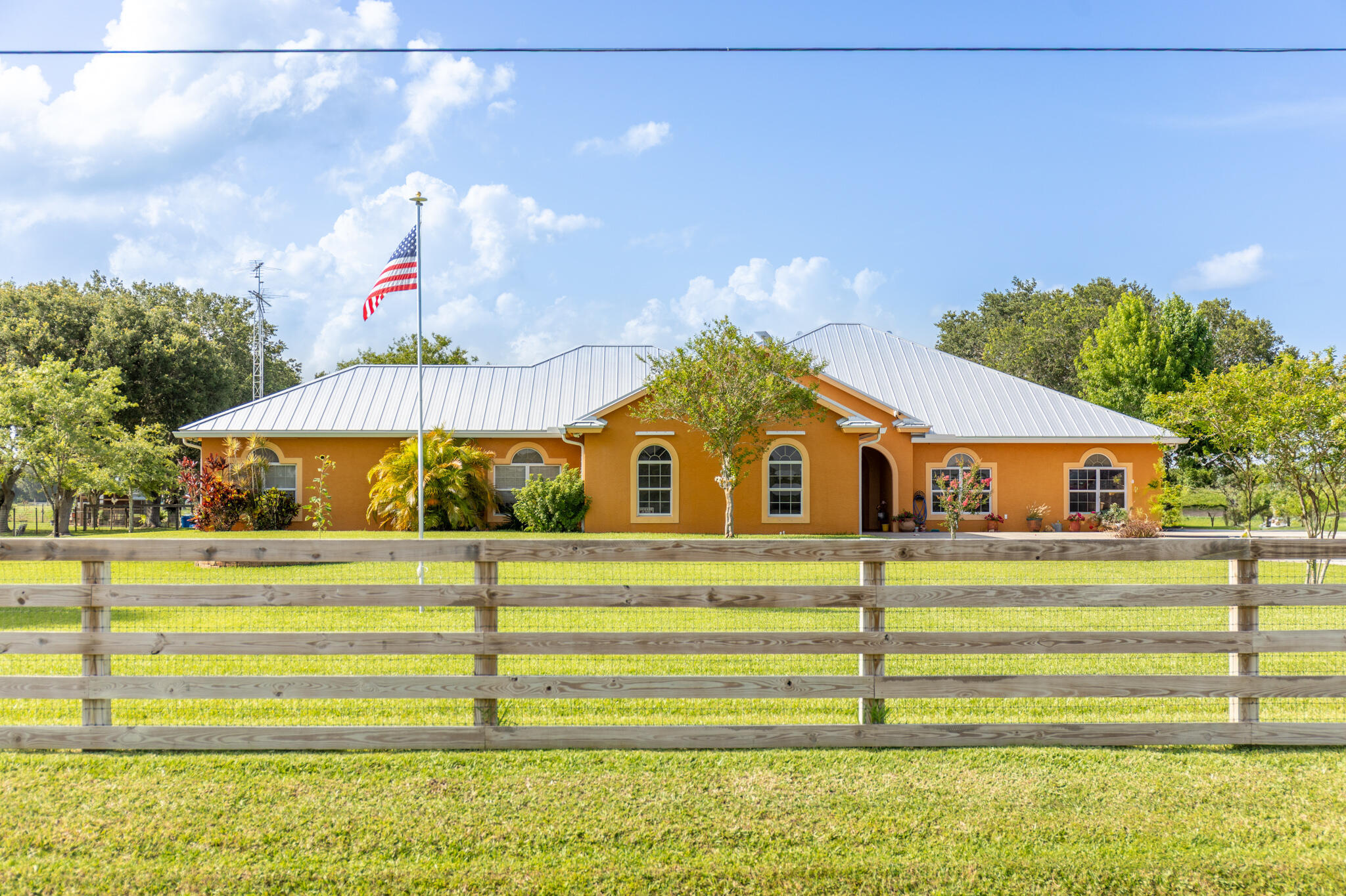 DON'T MISS THIS EXCEPTIONAL OPPORTUNITY TO OWN A BEAUTIFULLY MAINTAINED CUSTOM HOME SITUATED ON FULLY FENCED 2.02 ACRES IN A DESIRABLE LOCATION!  DESIGNED FOR COMFORT AND VERSATILITY, THE MAIN RESIDENCE FEATURES TWO SPACIOUS PRIMARY SUITES, MAKING IT IDEAL FOR MULTI GENERATIONAL LIVING OR HOSTING GUESTS. THE HEART OF THE HOME IS THE IMPRESSIVE CHEF'S KITCHEN, COMPLETE WITH GAS RANGE, ABUNDANT CABINETRY, AND GENEROUS WORKSPACE FOR ENTERTAINING.  ADDING EVEN MORE VALUE, THE PROPERTY INCLUDES A PRIVATE FULL SIZE APARTMENT WITH ITS OWN ENTRANCE AND LIVING SPACE, PROVIDING ENDLESS POSSIBILITIES. OUTSIDE YOU WILL FIND A LARGE METAL BUILDING WITH AN EFFICIENCY/OFFICE SUITE AND A FULL BATHROOM. FULLY FENCED YARD, WITH AUTOMATIC GATE.
