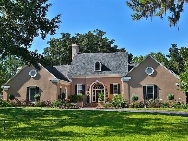 Welcome to this exceptionally updated 4-bedroom, 5.5-bathroom residence nestled in the desirable Summit II community of Ocala. This single-story home offers abundant room for comfortable living and entertaining. Step inside the grand entry with custom molding and soaring ceilings. The thoughtful floor plan has generously appointed rooms- formal living and dining, and a large family room. Master bedroom has separated his and her ensuite bathrooms and 3 walk in closets. All other guestrooms have ensuite baths and walk in closets. Mother-in-law suite has separate entrance with wheelchair access. Community and property are gated for added security. Covered patio, 2 courtyards and lap pool. 3 stall barn has room to expand w/ RV hookup and separate entry. 3 HVAC- 2 are newer. New French doors.