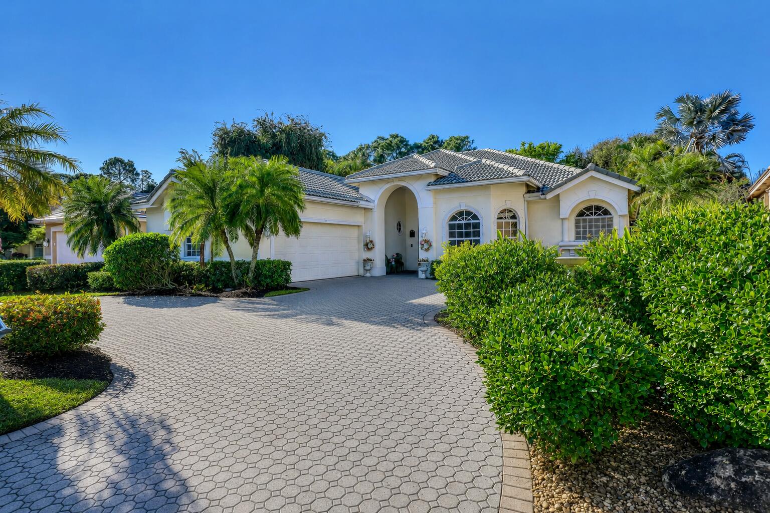THE ULTIMATE GOLF COMMUNITY LIVING IN PRESTIGIOUS PGA VILLAGE! Perfectly positioned along the 3rd hole, this beautifully appointed 3BR, 2.5BA home with a dedicated office offers sweeping fairway views, resort-style amenities & the relaxed elegance that defines country club living without the requirement of a golf membership. Designed for both entertaining & everyday comfort, the spacious interior features generous living areas, two HVAC systems and is fully equipped with all appliances, including washer & dryer. The 2-car garage and half-moon driveway provide excellent curb appeal with ample guest & golf-cart parking. Step outside to your own private oasis featuring a screened-in pool & spa overlooking the lush golf course backdrop. This is an exceptional value in a gated community!