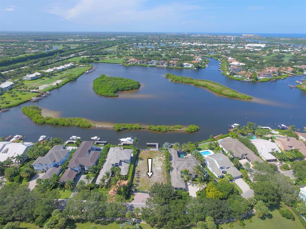 Water, water, water...the views from this lot in Admirals Cove  are unparalleled and is home to a 2020 brand-new, 2-story, 5-bedroom, master down, open floorplan, Contemporary/Modern -styled home designed by Randy Stoft. Prospective purchasers may view this site and be given a tour of a representive model in Old Palm. The floorplan is equally stunning.
