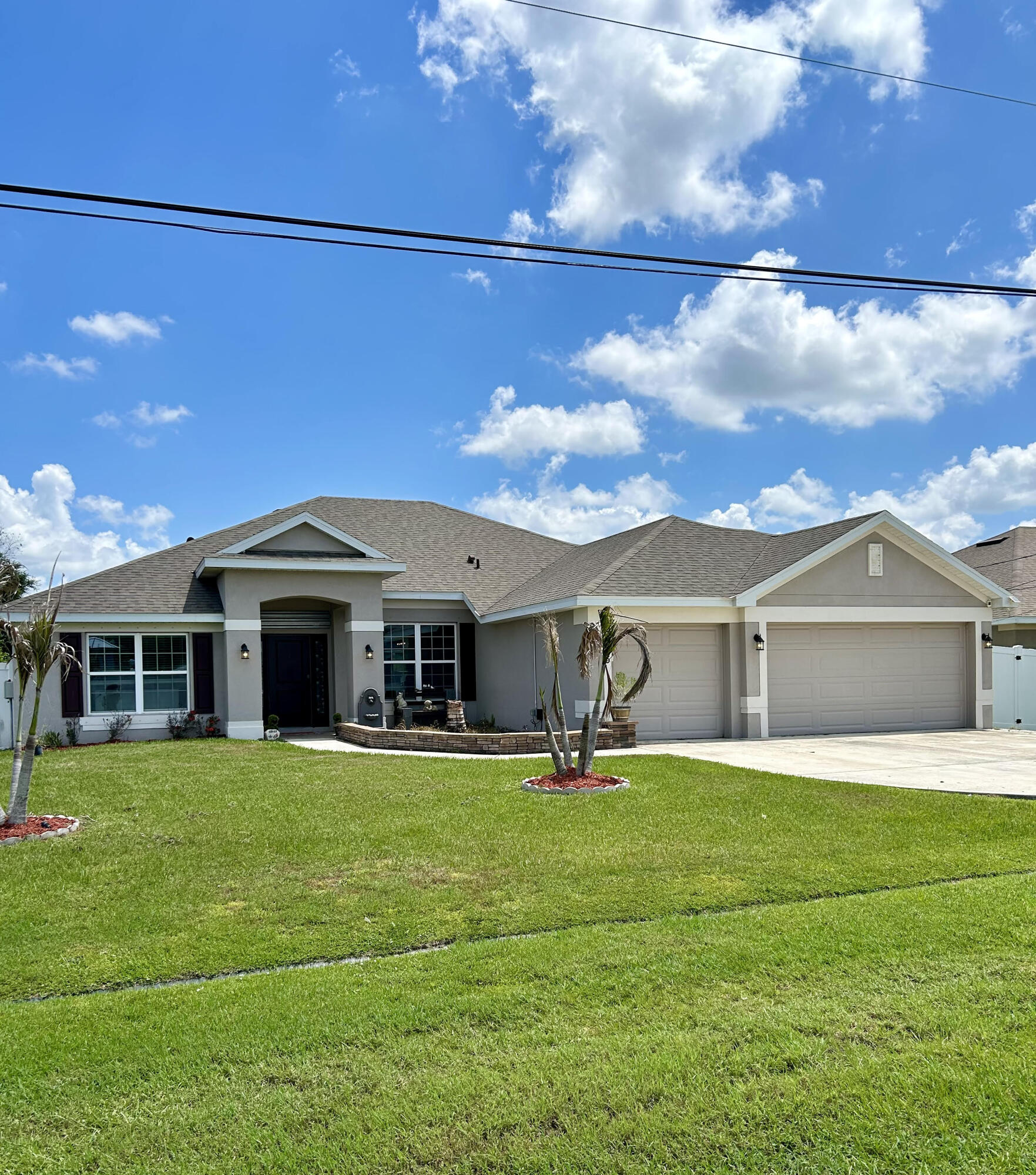 Welcome to this spacious 2020 CBS home in the highly sought-after Torino area! With over 2,200 sq ft, this layout is ideal for growing or multi-generational families. The property features 4 bedrooms, 3 full baths, a dedicated home office/den with custom built-ins, and an air-conditioned 3-car garage. Inside, enjoy an open, split floor plan with high ceilings and no carpet. The kitchen offers quartz counters, modern appliances, and a pantry. Unwind in the master suite, featuring two walk-in closets with custom cabinetry, dual vanities, and an upgraded shower. A cabana bath leads to the screened patio and a fully fenced backyard with room for a pool. Enjoy NO HOA, full hurricane protection, and major systems under 6 years old.  Minutes to the Mets stadium, and shopping and dining in St. Lucie West. Don't miss this gem!