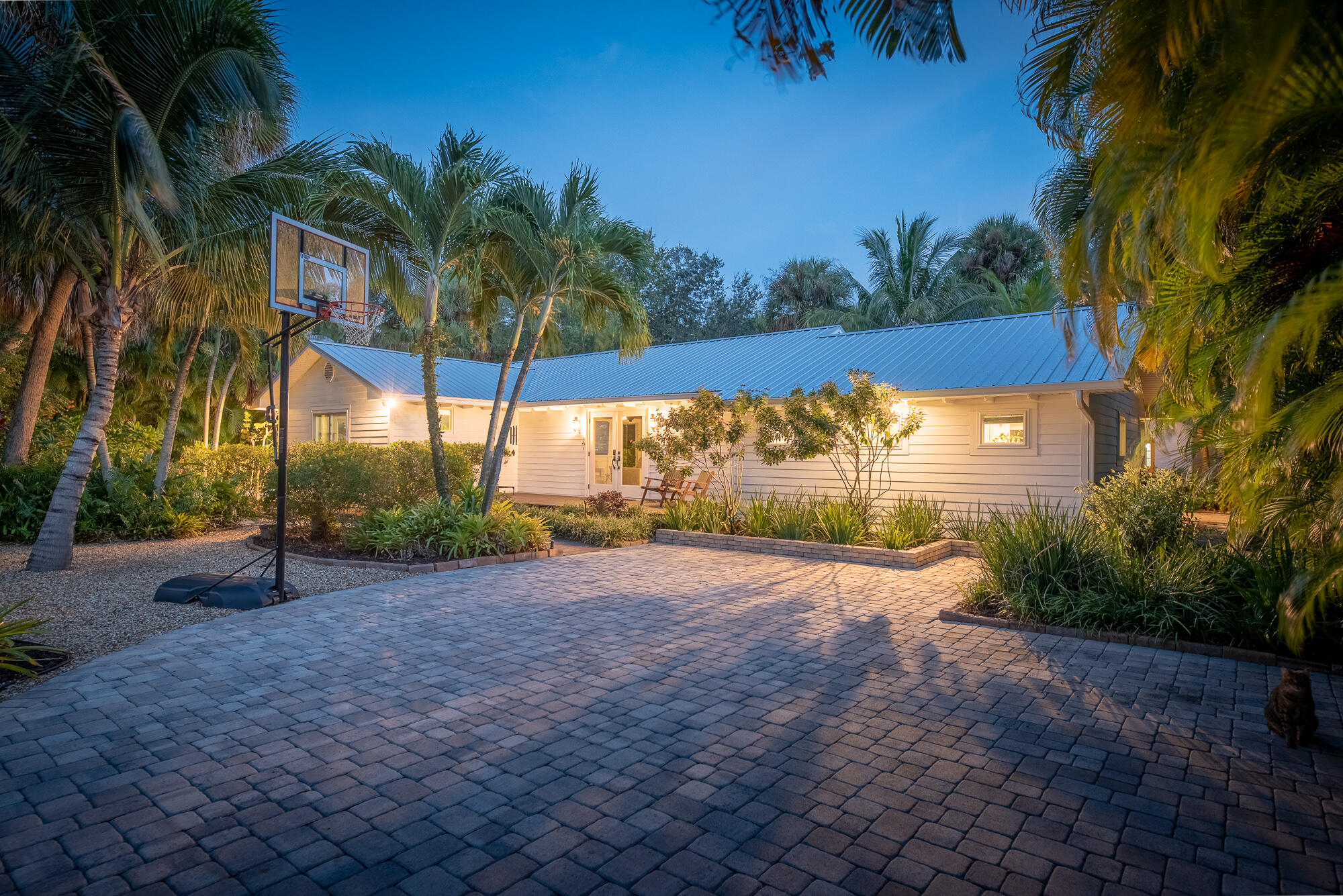 Rare Downtown Stuart Rental - Modern Luxury with Tropical Backyard & Jacuzzi! This stunningly remodeled 3 bed 3.1 bath home offers a perfect blend of modern elegance and ultimate convenience in one of Downtown Stuart's most desirable neighborhoods. Just minutes from top dining, shopping, and boat ramps! Step inside to an open floor plan with wood floors, tongue-and-groove ceilings, and impact-resistant windows & doors, filling the home with natural light. Each bedroom features its en-suite bath. Outside, enjoy a private oasis and a separate exercise room shed. A 2-car garage, durable metal roof, and premium finishes complete this exceptional home. Live just minutes from Stuart's best restaurants, waterfront parks, and beaches! No HOA. Available Now - Also available for sale.