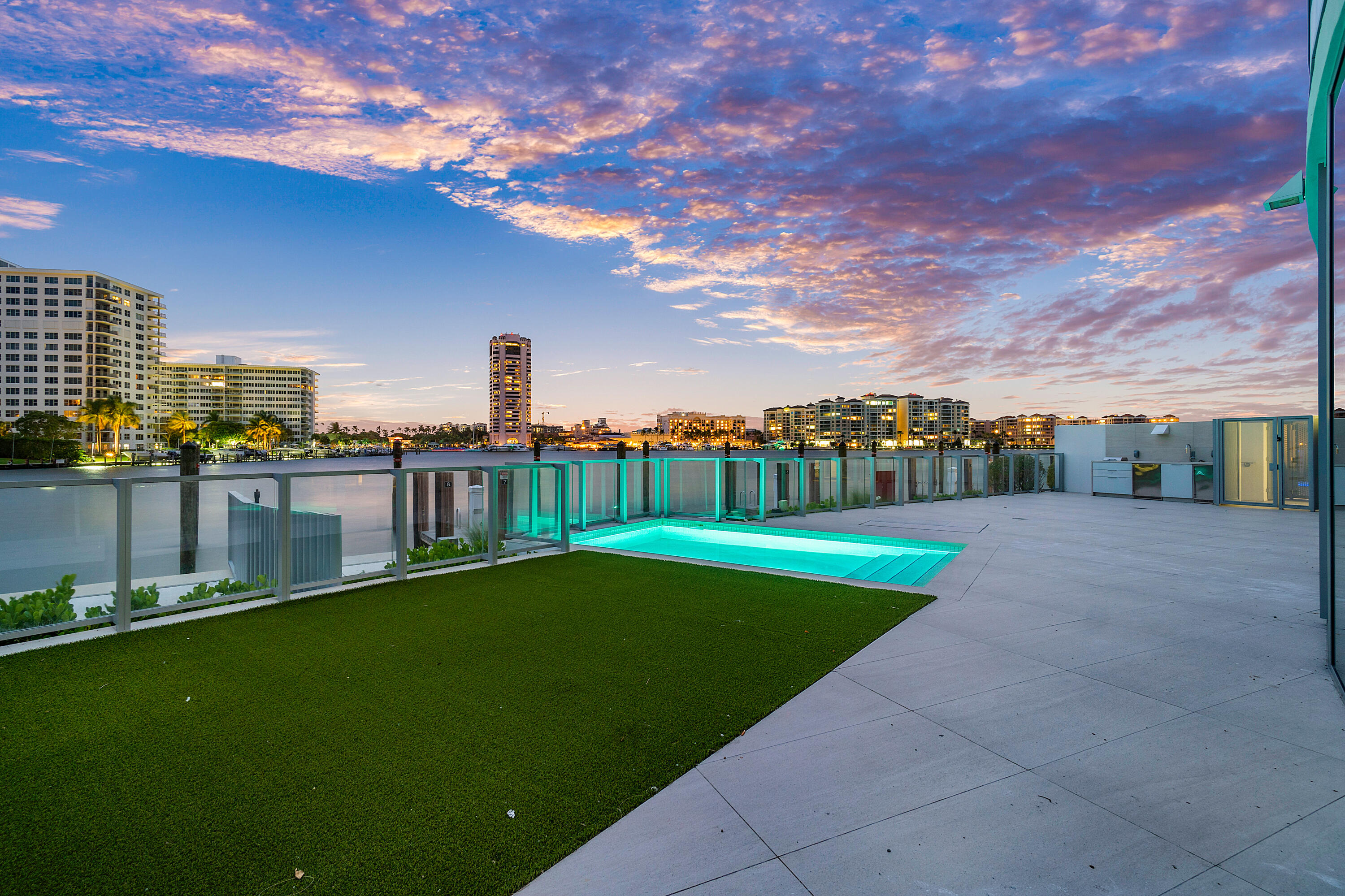 Welcome to the highly coveted Boca Beach Residences, where luxury living reaches new heights. This exceptional lanai unit offers a truly unparalleled experience, boasting a massive patio/lanai with incredible water views of Lake Boca Raton that will leave you breathless. Immerse yourself in the beauty of Lake Boca Raton, the intercoastal waterway and backdrop of the iconic Boca Raton Hotel as you relax on your private lanai. 
Unit 104 at the Boca Beach Residences is a unique lanai unit, showcasing unrivaled luxury and elegance. This magnificent dwelling represents the epitome of opulence, commanding attention as a coveted trophy property that is highly sought after by discerning individuals. With its meticulous craftsmanship and attention to detail, this residence exudes a timeless charm that effortlessly merges with modern sophistication. Boasting breathtaking panoramic views of Lake Boca Raton, the lanai unit offers an unparalleled sense of tranquility and exclusivity. Every aspect of this exceptional property has been thoughtfully curated to indulge the most discerning tastes, making it a true gem. Step outside onto your own private pool deck, complete with a summer kitchen, perfect for entertaining guests or enjoying intimate dinners alfresco. Imagine basking in the warm Florida sun, taking a refreshing dip in your pool, and savoring the stunning vistas that surround you. But the luxury does not stop there. This exquisite lanai unit also comes with its own boat slip, directly behind your unit allowing you to indulge in your passion for boating and water sports with ease. Cruise along the sparkling waters, explore the coastline, and create unforgettable memories right from your doorstep. When you arrive home, you will be greeted by the convenience and security of your own two car air-conditioned private garage space, equipped with electric vehicle charging capability and electronic doors. Say goodbye to the hassle of parking and enjoy the peace of mind that comes with knowing your vehicles are safe and protected in your very own garage. As you take your private elevator into your unit and step inside, you will be enveloped by luxury and style. The condominium will be professionally decorated by the award-winning P And H Interiors, ensuring that every detail is thoughtfully curated to perfection. The spacious kitchen features top-of-the-line appliances, including a Gaggenau refrigerator/freezer, wine cooler, oven in addition to Bosch appliances, allowing you to unleash your culinary creativity with ease. Pamper yourself with the luxurious amenities offered by the Boca Beach Residences. From the indulgent valet service to the attentive 24-hour concierge, every aspect of your daily life is catered to with the utmost care and attention. Experience a lifestyle of unparalleled comfort and convenience. This exceptional lanai unit offers a well-designed layout, with three bedrooms plus a den, three- and one-half baths, providing ample space for relaxation and privacy. The light-filled rooms create an inviting atmosphere, displaying the breathtaking water views that surround you. Additionally, the unit features a powder room for guests and a separate laundry room, ensuring that every aspect of your daily routine is effortlessly accommodated. It is important to note that the Boca Beach Residences is an exclusive boutique condominium, with only 32 units in the building, of which only 8 are lanai units. This unit is a true trophy property and is close to the privacy of a private home. This property has been completely sold out for quite some time. Now is your opportunity to own a rare residence in this highly sought-after community. Don't miss the chance to call this exceptional and scarce lanai unit at the Boca Beach Residences your own. Experience luxury, breathtaking views, and a lifestyle that is truly unparalleled.