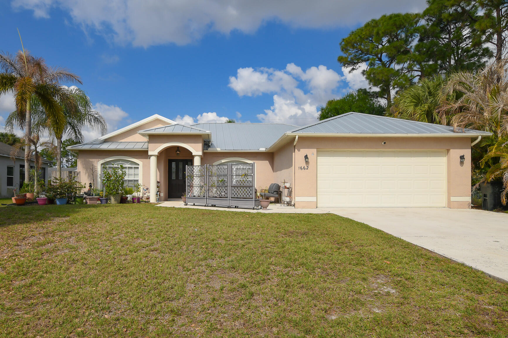 Beautiful 3BR/2BA/2CG pool home near Tradition with major updates already done! New metal roof, A/C, water heater, and solar pool heating system all within the last 4 years. Enjoy Florida living in your screened private pool area with plenty of space for relaxing or entertaining. Light and bright layout with comfortable living areas and great indoor/outdoor flow. Located just minutes from Tradition Square, shopping, restaurants, hospitals, and I-95 for easy commuting. Great opportunity to own an updated Port St. Lucie pool home in one of the area's fastest growing and most desirable locations.
