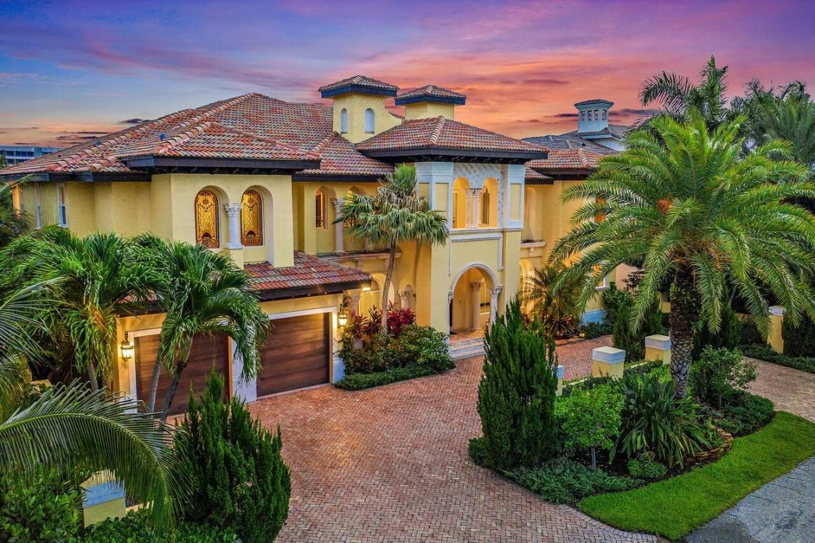 Fully furnished and move-in ready! This custom 5 bed + optional 6th bed, 6 bath waterfront estate is located on a deep water canal just two lots off the intracoastal canal. Enter through the Chicago brick circular driveway and oversized mahogany Renaissance wood carved front door, and be greeted by a wrought iron spiral staircase and polished marble floors. The chef's kitchen features granite countertops, oversized island, top of the line SS appliances, & beverage center perfect for entertaining. Primary bedroom features a spacious sitting area, custom California closets, dual vanity bathroom, and private covered balcony. Backyard boasts 90ft of water frontage and dockage, 20,000 lb elevator boat lift, composite wood dock, heated swimming pool and spa, and summer kitchen. Also for rent.