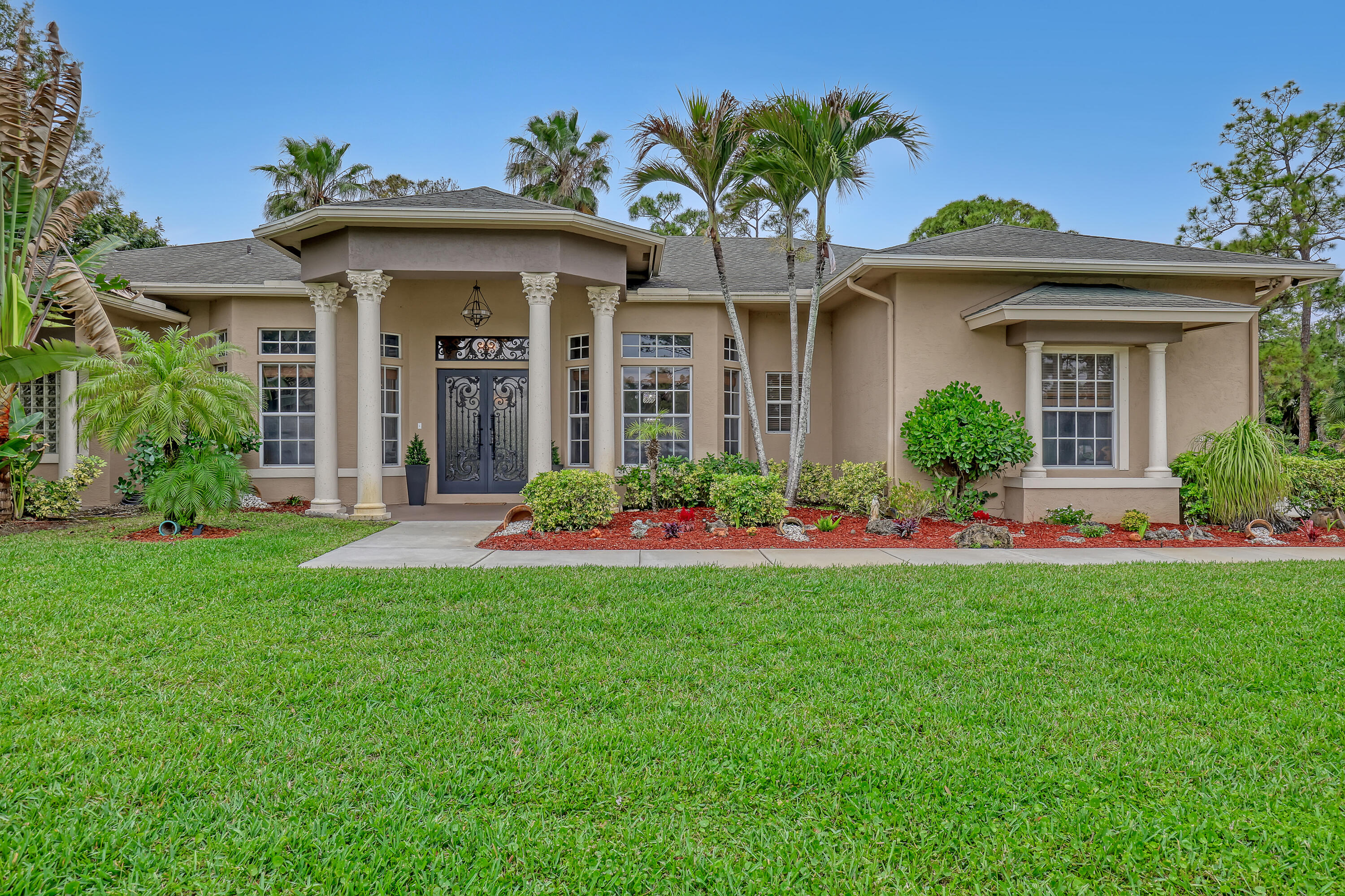 Experience the best of indoor/outdoor Florida living in this beautifully maintained estate home featuring expansive entertaining spaces,a huge covered lanai,summer kitchen, and oversized private backyard.Custom impact iron double entry doors welcome you into a spacious interior with an upgraded kitchen ,stainless steel appliances,wood cabinetry ,granite countertops, and plantation shutters throughout. The oversized primary suite features dual walk in closets and a spa-style bath. Two A/C units and numerous upgrades complete this exceptional property , too many extras to list ,hurry a must see......