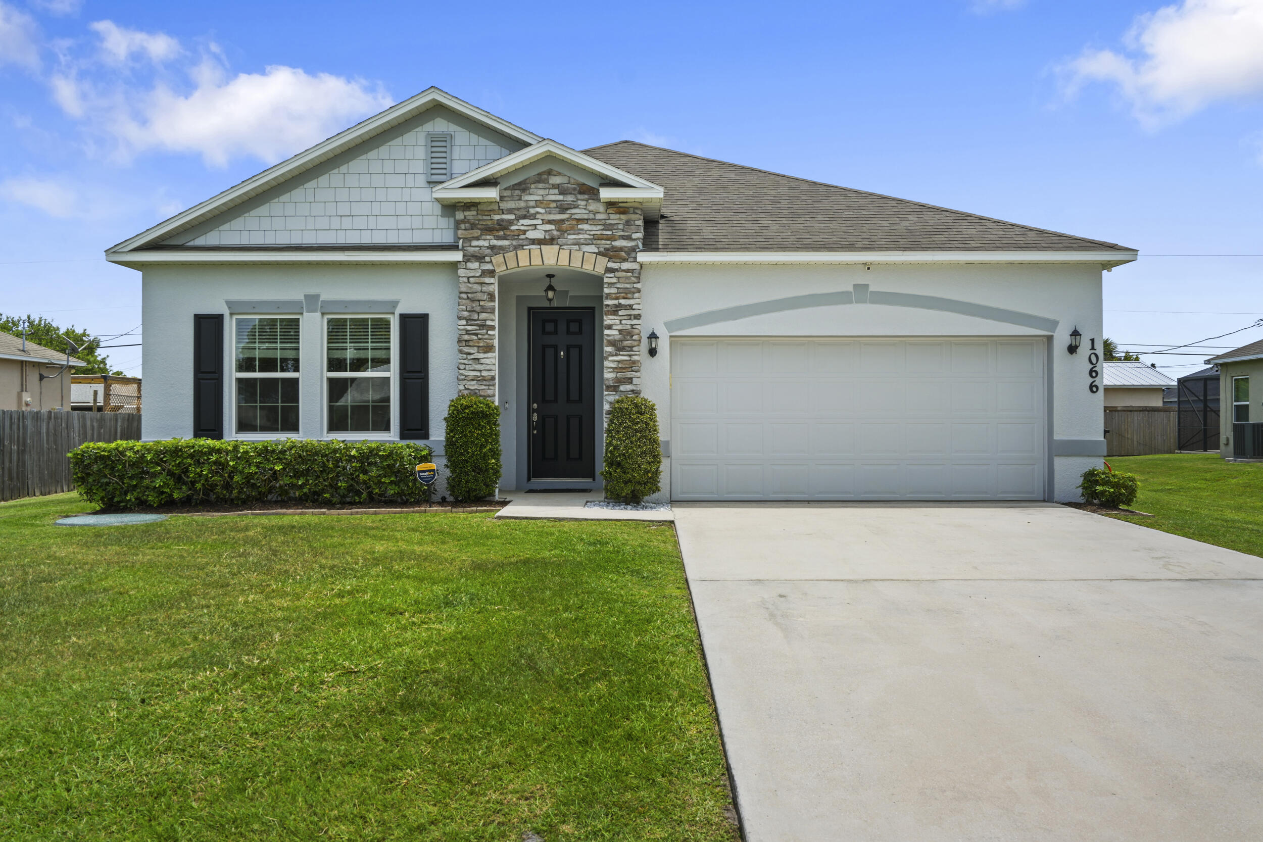 Beautifully maintained 4-bedroom, 2-bath CBS home built in 2018, offering over 2,000± square feet of comfortable living space in the heart of Port Saint Lucie. This spacious residence features an open-concept floor plan with generous living and dining areas, a well-appointed kitchen with ample cabinetry and counter space, and a split-bedroom layout for added privacy. The primary suite offers a spacious retreat with en-suite bath and walk-in closet. Enjoy a large backyard with room for a pool, outdoor entertaining, or future customization. Complete with a 2-car garage, newer construction peace of mind, and a convenient location close to shopping, dining, schools, parks, and major commuter routes. A fantastic opportunity to own a move-in ready home in a growing Port Saint Lucie neighborhood.
