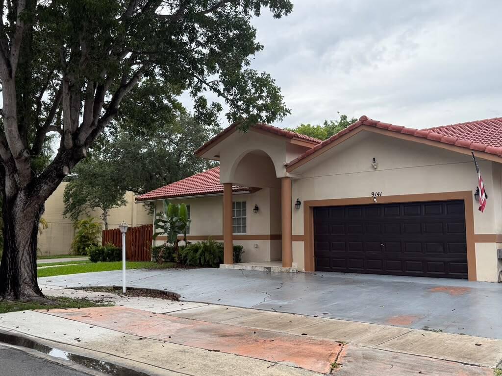 Welcome to this inviting single-story residence in West Lakes Gardens 2nd Addition, Miami Lakes. EXCELLENT PUBLIC SCHOOLS This three-bedroom, two-bathroom upgraded home encompasses well-appointed living space designed for comfortable everyday living. Lots of counterspace in your upgraded kitchen with 30 inch ceramic tiles through entire home. Master bath has shower/tub combo and an additional shower in master bath. Extra large hall closet for additional storage. The two-car garage provides convenient vehicle storage or work area. Located in Miami Lakes, this property offers a practical floor plan that maximizes functionality across all living areas. Discover the potential of this straightforward, well-structured home. Landlord requires renters insurance.