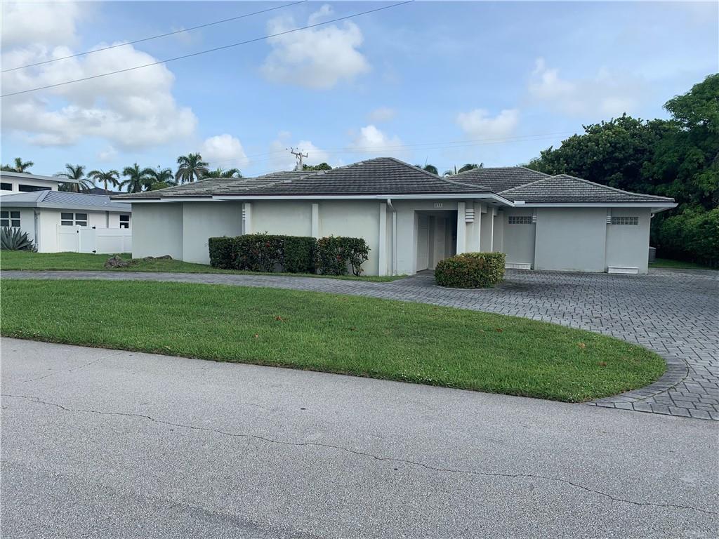 Come live BEACHSIDE in this Sprawling 4 Bedroom, 3.5 Bath, Pool Home in the Very-Desirable neighborhood of Riviera in EAST BOCA RATON.  This 2800+ sq. foot home, with 4155 total living sq. ft., includes 2 full master suites (1 could be a mother-in-law suite, or made into a separate apartment).  The large Diamond-Brite pool is fully-screened, heated, has an outdoor shower and is the central focus of the entire back of the house, including the master suite, living room, kitchen and family room.  With sturdy CBS construction, this house boasts a 2-car garage, circular driveway and car park. (enough parking for 8-9 cars).  Central heat and A/C, Formal Dining Room, Pass-through dining from kitchen to outside patio, this house HAS IT ALL!  Newer Roof of articulated concrete tile!!  A RARE FIND!!