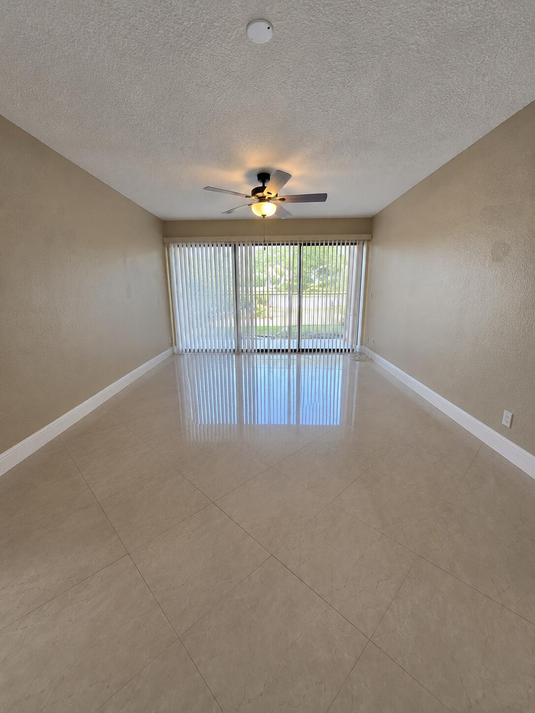 Beautiful 3-bedroom, 2-bathroom first-floor condo in the Palm Beach Place community! This spacious unit features ceramic tile flooring throughout, stainless steel appliances, granite countertops, decorative ceiling fans, and a full-size in-unit washer and dryer. The open layout offers comfortable living spaces and generously sized bedrooms. Palm Beach Place features resort-style amenities including a pool, fitness center, clubhouse, scenic lakes, and onsite management. Conveniently located just minutes from the Florida Turnpike, I-95, shopping, dining, schools, and entertainment. Don't miss this fantastic rental opportunity—schedule your showing today!