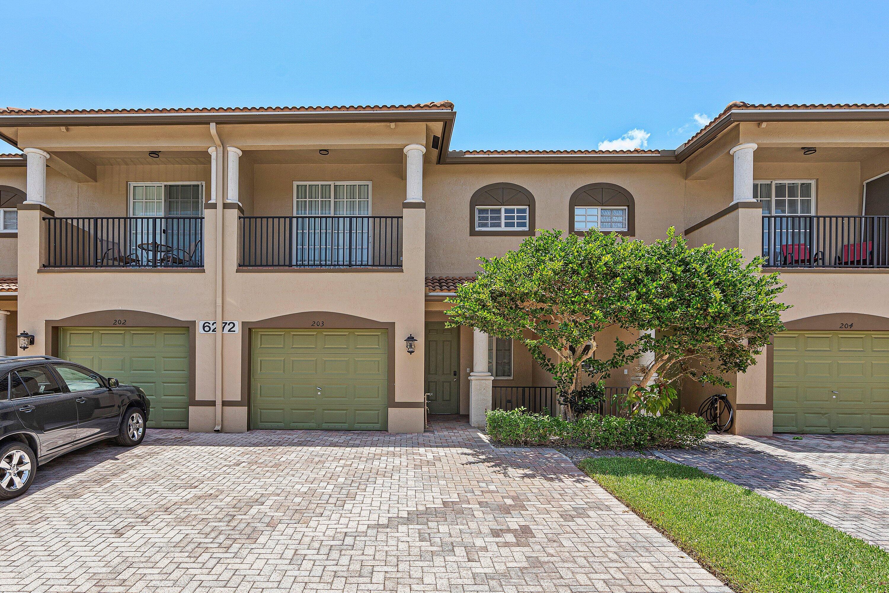 Don't miss this exceptional opportunity to own a cozy townhome in the desirable Pine Key Reserve community very close to schools, shopping, dining, entertainment, Palm Beach State College and beach. This home features 3 spacious bedrooms, 2 bathrooms, powder bathroom downstairs, attached one car garage. Inviting layout with tile flooring throughout the main level and new carpeting upstairs.  All three bedrooms are located on the second floor, including a spacious primary suite with a walk-in closet, dual vanities, a soaking tub, separate shower, and a private balcony - to enjoy your morning coffee. The upstairs laundry room adds everyday convenience, while the open living and dining areas provide plenty of space for relaxing or entertaining guests.  Ideally situated just a short walk from the community clubhouse, pool, and playground, you'll have resort-style amenities right at your doorstep. The condo association handles exterior maintenance, including landscaping, roof care, and exterior painting, making homeownership easy and low maintenance. Conveniently located near top-rated schools, shopping, restaurants, entertainment, and major highways. Motivated seller—don't miss this opportunity!