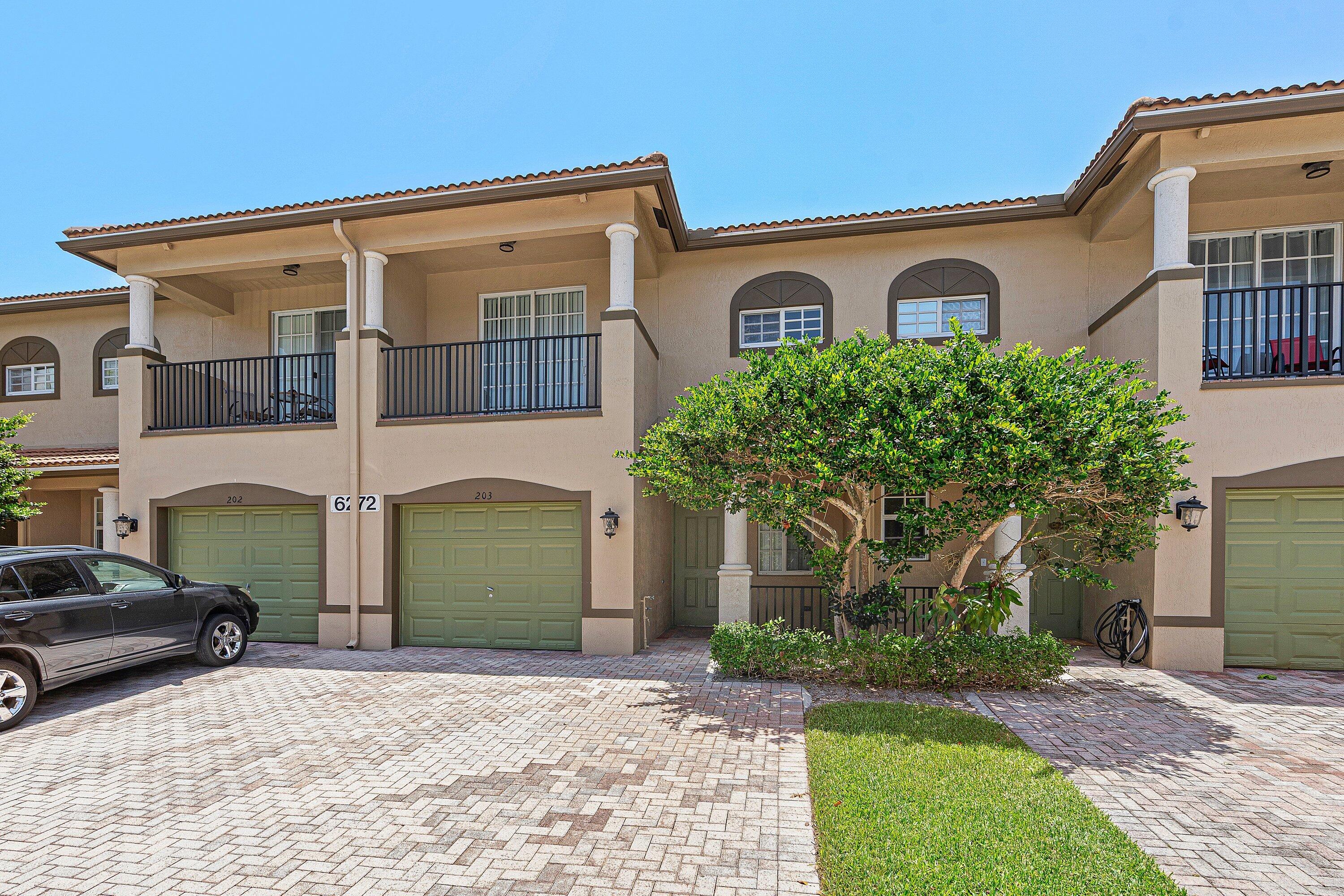 Don't miss this exceptional opportunity to own a cozy townhome in the desirable Pine Key Reserve community very close to schools, shopping, dining, entertainment, Palm Beach State College and beach. This home features 3 spacious bedrooms, 2 bathrooms, powder bathroom downstairs, attached one car garage. Inviting layout with tile flooring throughout the main level and new carpeting upstairs.  All three bedrooms are located on the second floor, including a spacious primary suite with a walk-in closet, dual vanities, a soaking tub, separate shower, and a private balcony - to enjoy your morning coffee. The upstairs laundry room adds everyday convenience, while the open living and dining areas provide plenty of space for relaxing or entertaining guests.  Ideally situated just a short walk from the community clubhouse, pool, and playground, you'll have resort-style amenities right at your doorstep. The condo association handles exterior maintenance, including landscaping, roof care, and exterior painting, making homeownership easy and low maintenance. Conveniently located near top-rated schools, shopping, restaurants, entertainment, and major highways. Motivated seller—don't miss this opportunity!