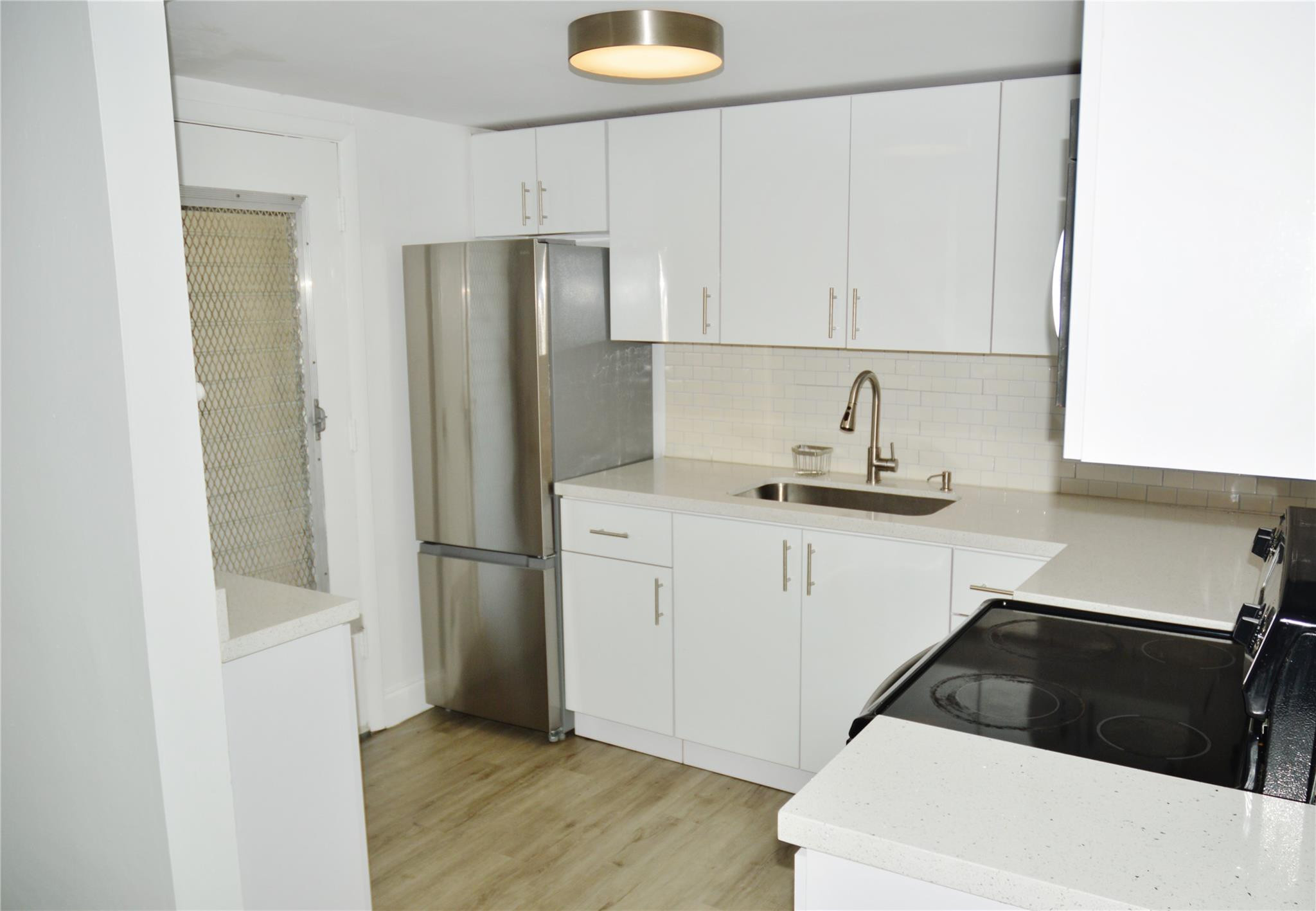 Located near the Turnpike and I95. Close to shopping and entertainment. This nice spacious 1 bed 1 bath condo has an updated kitchen with beautiful white cabinets/diamond-brite counter tops and stainless-steel appliances. A cozy dining area just beyond the entrance, large living room, and laminate floors throughout. It has a South facing screened patio. The bedroom features a large walk-in closet for wardrobe and a second closet for storage. There is additional storage on ground floor. A brand-new A/C unit replaced in 2024. Community pool and laundry room inside the complex. One assign parking space and guest parking. Low maintenance fees. If you are looking for a semiprivate community where you can relax and enjoy the surroundings come and check this one out. All ages community.