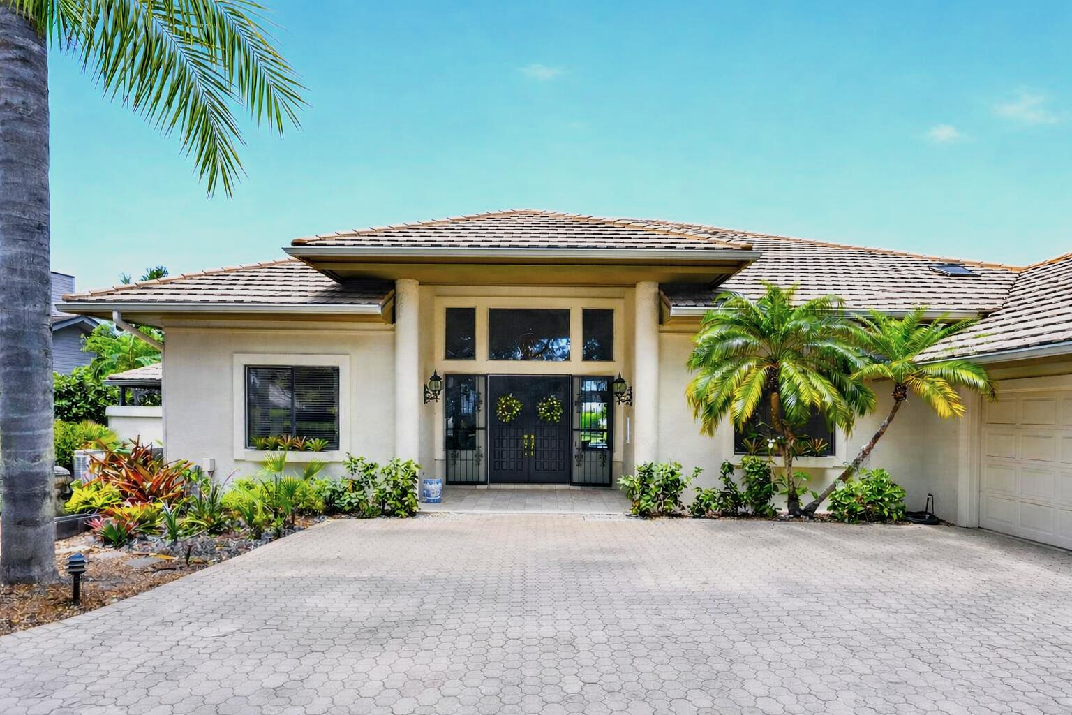 Located in the exclusive golf community of Mariner Sands Country Club, this 3,783 square feet, this stunning 3-bedroom, 4-bath home offers a great layout and spectacular views!  Need extra space? There's an additional room that can easily become a fourth bedroom and already includes a private ensuite bath.  Designed for indoor-outdoor living, the expansive screened lanai showcases a resurfaced pool and a new enclosure (2022) with windowpane screens, offering uninterrupted views of the water and fairways. Inside, the family room with 18' ceilings and separate dining area provide ideal settings for both relaxed living and entertaining. The elegant kitchen features brass fixtures and quartz countertops, along with a beautiful 6 burner gas range and double ovens. The generously sized primary suite is complete with a large walk-in closet, an additional flex room perfect for an office or second closet, and a spa-like bath with a Jacuzzi tub and a striking walk-in shower accented with nautical blue tile.  Both guest bedrooms offer private ensuite baths. Additional highlights include a golf cart garage, workshop space, and a circular driveway, all within one of the Treasure Coast's most sought-after private golf communities.  Residents enjoy two championship 18-hole golf courses, Har-Tru tennis courts, pickleball, croquet, and a state-of-the-art fitness center. The community also features a resort-style pool with a separate lap pool, along with the Sand Bar offering exceptional indoor and outdoor casual dining. The spectacular new clubhouse provides both fine and casual dining, along with weekly social events and happy hours. Additional amenities include a dog park, playground, spa, and nail salon—all just minutes from pristine beaches and charming downtown Stuart. Social membership is required with a one-time capital contribution of $50,000 due at closing. Golf membership is separate and optional.