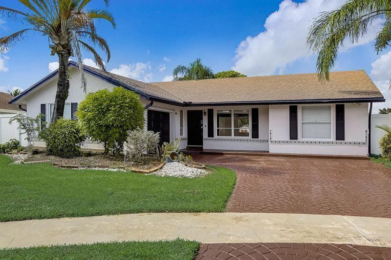 Beautifully updated 3 bedroom 2 bath house nestled on a cul-de-sac with a wide lakefront lot on a quiet and friendly street. Kitchen has granite counter tops and newer stainless steel appliances. Florida room in the back leads out to large paver patio overlooking an amazing lake view and backyard. Community pool and parks. Easy and quick association approval. Great location close to shopping, restaurants, golf and more.