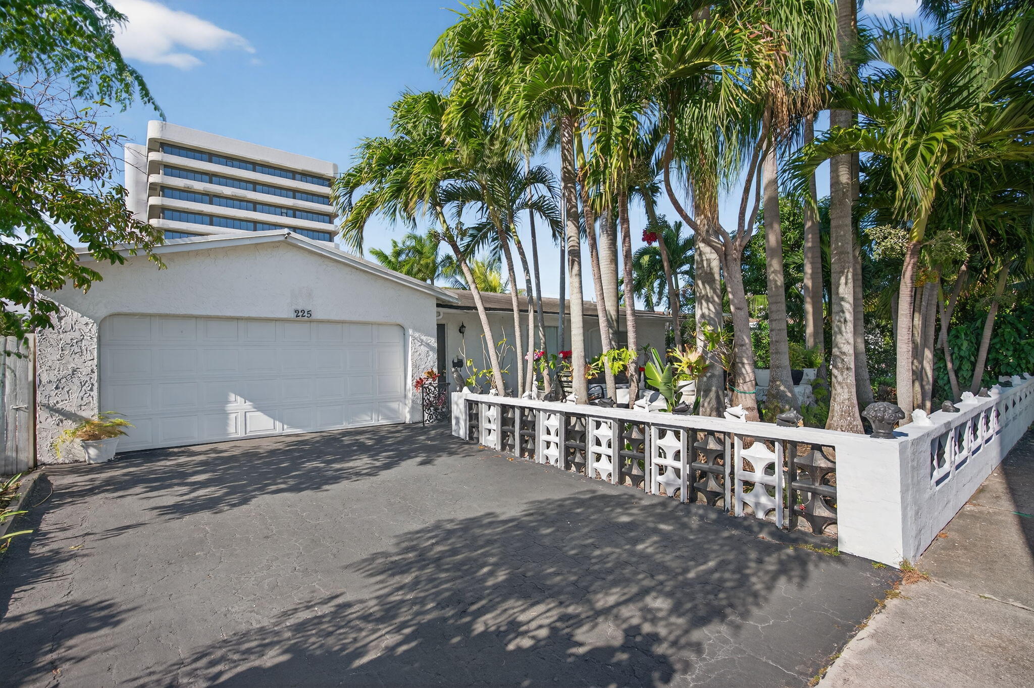 Welcome home to this spacious 3-bedroom, 2-bath residence offering comfortable living with NO HOA! The bright, functional layout features generous living areas, a light-filled kitchen with ample cabinetry, and spacious bedrooms. Step outside to your own private tropical retreat with mature landscaping, fruit trees, and an abundance of palm trees, perfect for relaxing or entertaining. A 2-car garage adds convenience and storage. Ideally located just minutes from I-95, Palm Beach Outlets, hospitals, restaurants, shopping, and everyday conveniences. Whether you're looking for a primary residence or investment property, this home offers space, flexibility, and a fantastic West Palm Beach location!