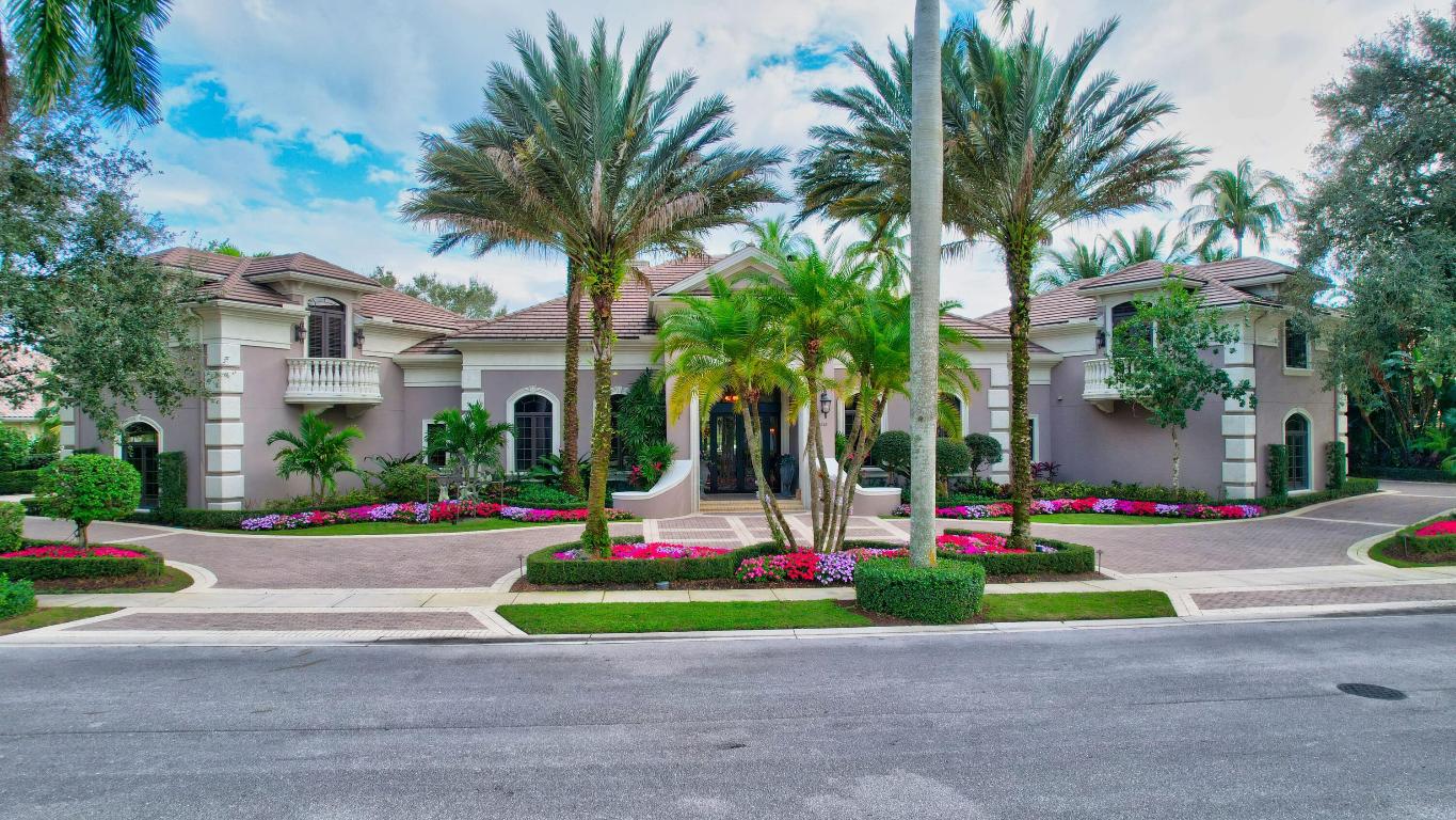 Situated on a double-lot with expansive lake views, highly coveted enclave of Grand Oaks in Broken Sound Country Club, this residence designed by the award-winning Affinity Architects exudes unparalleled craftsmanship and sophistication. The floor-plan is exceptional for everyday living and special entertaining. 

This one-of-a-kind home features a vast living room with lake views & fireplace, formal dining room perfect for hosting large events, custom library, and home theater with full bar.

The primary suite is a sanctuary of luxury, featuring his-and-her bathrooms, his-and-her closets, fireplace, built-in display cabinets, private home office with built-ins, a morning kitchen and lake views. The two stand alone suites on the upper level, on opposite sides of the home, are perfect for extended stays or live-in help.

The private, main floor guest wing features three spacious, ensuite-bedrooms with walk-in closets.

The kitchen is a masterpiece of functionality and beauty, with spectacular wood cabinets, a massive walk-in pantry, butler's pantry, a great breakfast bar, and an array of high-end appliances. Additionally, the kitchen features a spacious sitting room with great views and access to the backyard and the side yard.

The backyard is an oasis of its own- with three separate sitting spaces with a gas fireplace, extra-large pool and spa, lush landscaping, and sweeping lake views. This home built by NMB Custom Homes stands as a testament to the art of interior design, as shown by the decorative ceilings, where every last detail has been considered and executed to perfection, resulting in a residence that is as breathtaking as it is functional.