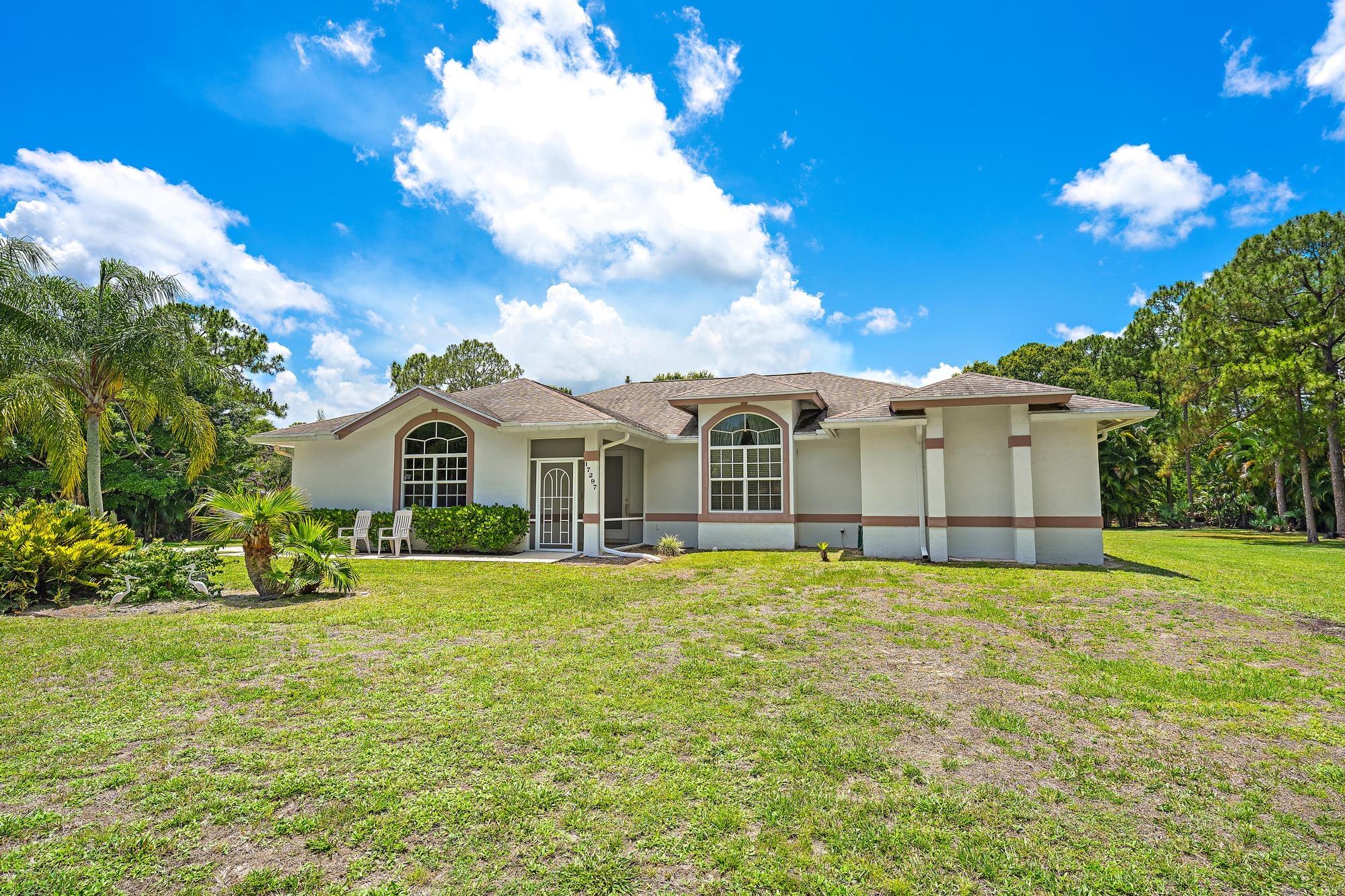 Well Maintained 3 bedroom, 2 bathroom CB home in Jupiter Farms. Home is located on a paved road. Full impact doors and windows, roof is 11 years old. Home is fully fenced in and has large screened in patio in the back. 2 sheds come with the home. This home is priced to sell fast!