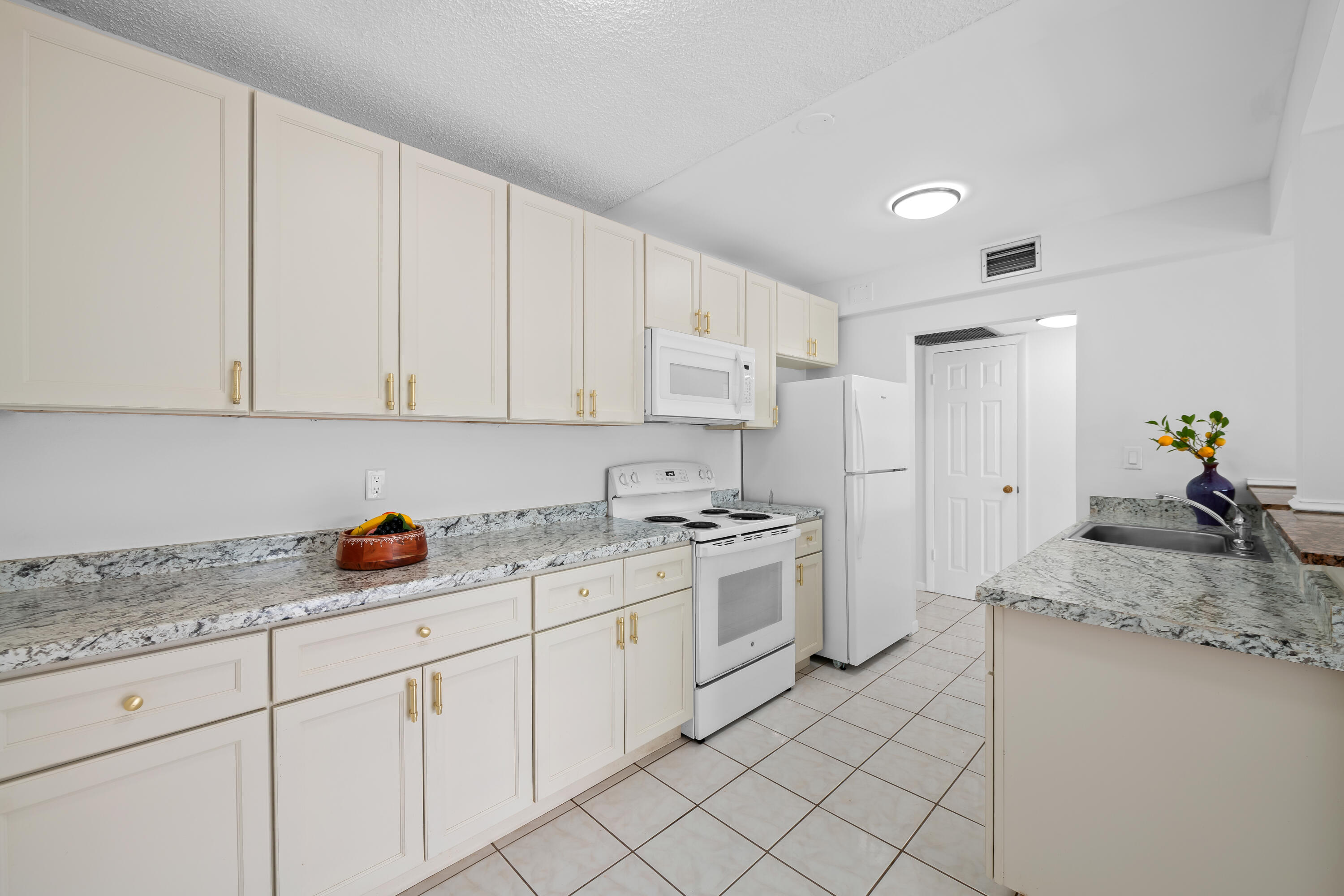 Bright & Airy well-kept 1/1 condo located at Sabal Palm Village in Tamarac, 55+ Community. This immaculate cozy unit is located on the 2nd floor, Large open concept extended kitchen cream cabinets w/ Formica counter tops & newer appliances. Tile & laminate flooring throughout, NEW A/C, NEW light fixtures & Fans Large M/bedroom with walk-in closet & side closet. Enclosed patio with Jalousie windows- Can be used as a Den/Office. Laundry room on premises located on same floor, unit comes w/ extra storage. The association offers a clubhouse with library, fitness room, heated pool, BBQ area & tennis courts etc. Secured Lobby. Mins to Turnpike, Shopping Plazas and Restaurants. Bright, Airy & Move-In Ready! Welcome to this beautifully maintained 1-bedroom, 1-bath condo in the desirable 55+ community of Sabal Palm Village in Tamarac. Located on the second floor, this immaculate residence offers a spacious open-concept layout featuring an extended kitchen with cream cabinetry, ample counter space, and newer appliances. Enjoy easy-care tile and laminate flooring throughout, a brand-new A/C system, updated light fixtures, and modern ceiling fans. The oversized primary bedroom boasts a walk-in closet plus an additional side closet, providing plenty of storage space. Relax in the enclosed patio with charming jalousie windows—perfect as a den, home office, reading nook, or bonus living area. Additional conveniences include a same-floor laundry room and assigned extra storage.Residents enjoy an active lifestyle with outstanding amenities, including a clubhouse, library, fitness center, heated pool, BBQ/picnic area, tennis courts, and a secure lobby entrance. Ideally located just minutes from the Florida Turnpike, shopping centers, dining, and everyday conveniences. Don't miss this opportunity to own a pristine, low-maintenance home in a welcoming and vibrant community!