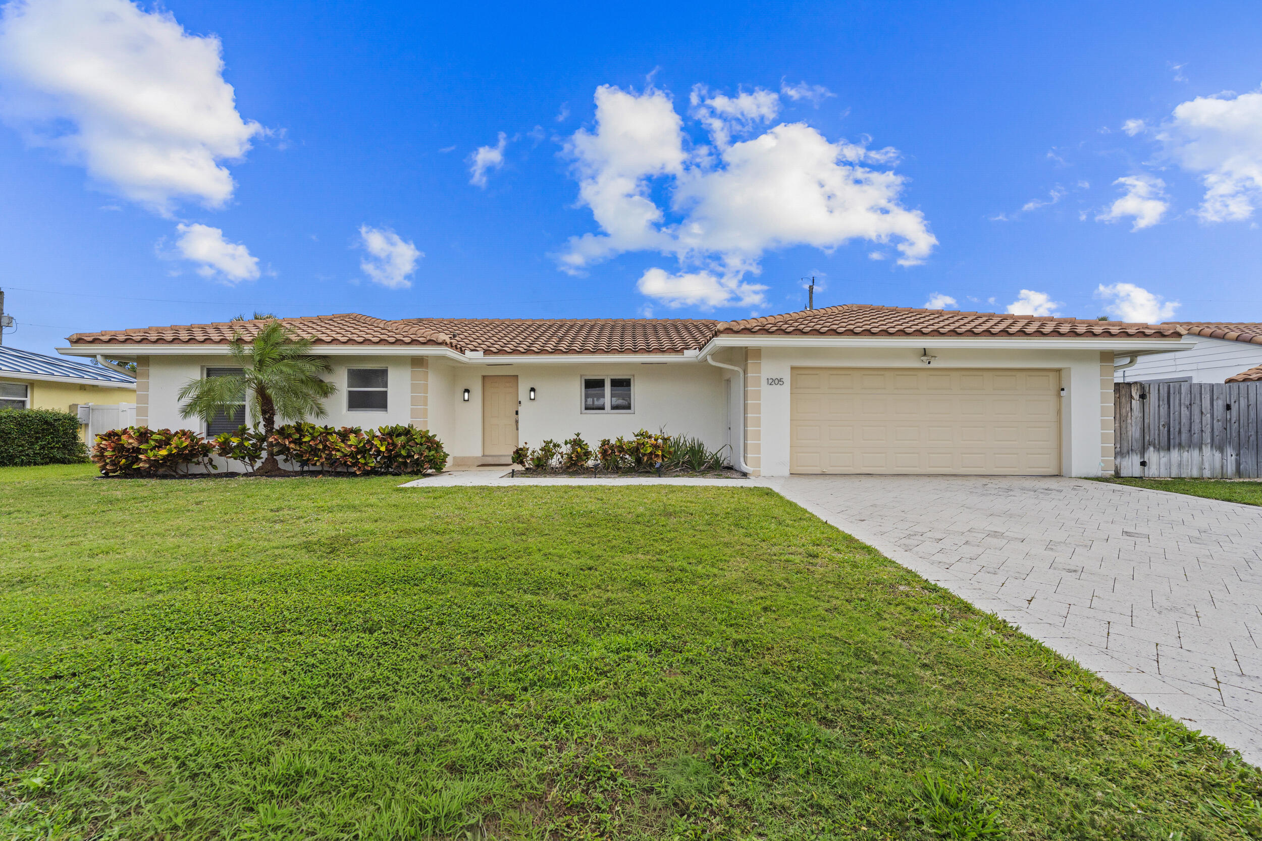 Welcome to your beach getaway on Singer Island! This charming 3-bedroom, 2-bath home is the perfect place to relax and enjoy coastal living.    Step outside to a large backyard with plenty of space to play, entertain, or unwind. The pool and spa make it easy to enjoy sunny days and peaceful evenings right at home.    Best of all, you are just a short walk to the beach, so you can enjoy the ocean anytime you like. Whether you are looking for a full-time home or a vacation retreat, this property has everything you need to live the island lifestyle.