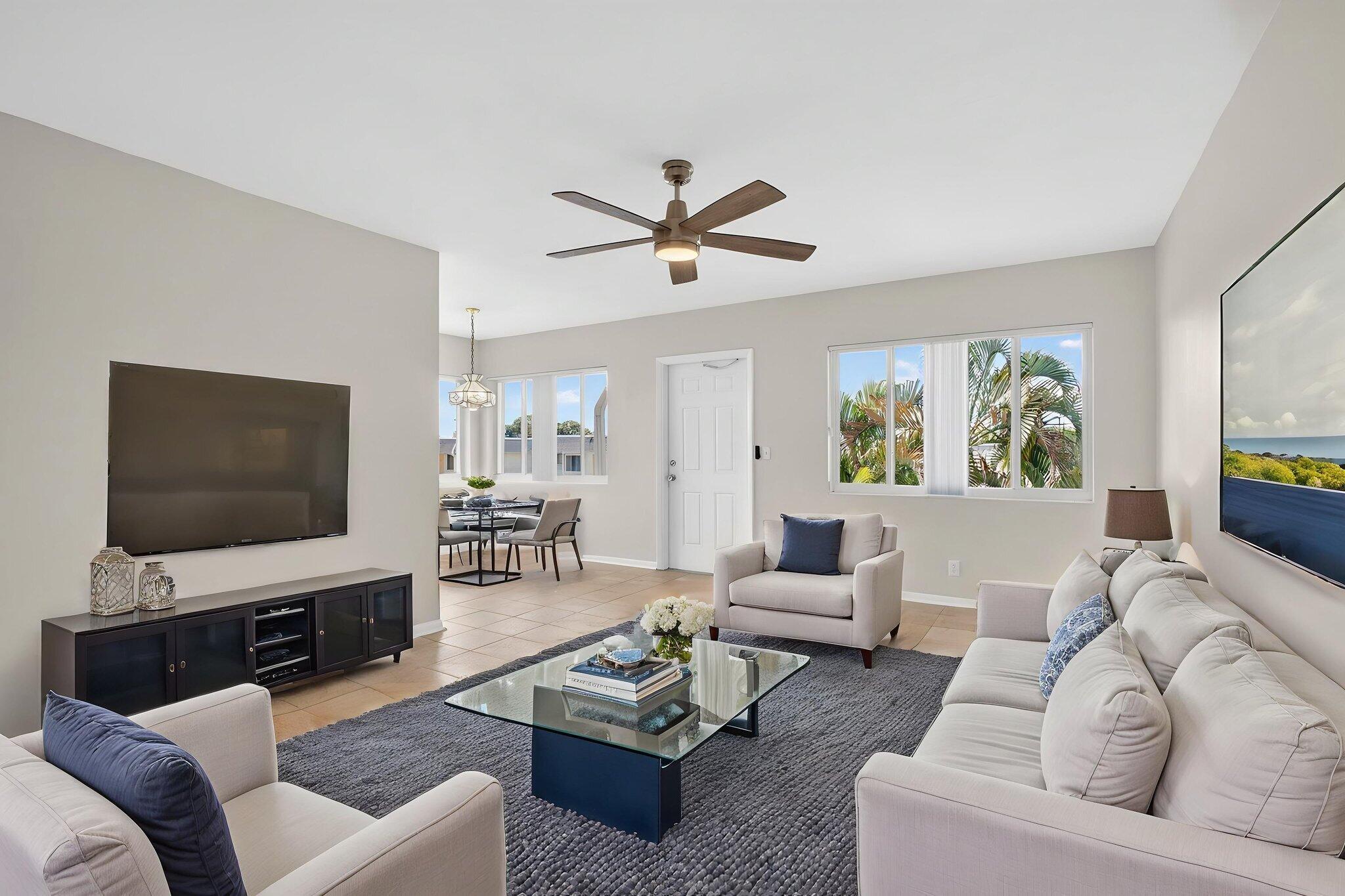 This is a jewel of a unit. Move-in ready! 2 bedrms/1 bath. Large WIC. Gorgeous tile floors mimicking travertine. High-end renovation in kitchen w/premium cabinets & granite countertops. Lots of natural light because it's an end unit w/4 extra windows on East side of unit. NEW windows throughout including balcony overlooking pretty green space and private SFH neighborhood. Bldg 23 sits behind recreation bldg w/large pool, pickleball/shuffleboard/bocce ball courts, putting green, BBQ area, auditorium, craft room, library, 2 gyms, saunas, etc. Bldg 23 sits on small hill providing views over neighboring buildings. Unit location in community provides tremendous privacy compared to other units here. Tinted windows help lower utility costs. Close 2 beach, 95, Tri-Rail. Grab this one quick! Well-managed 55+ development across from 750-acre John Prince Park and Lake Osborne. No pets. 700+ credit score required.