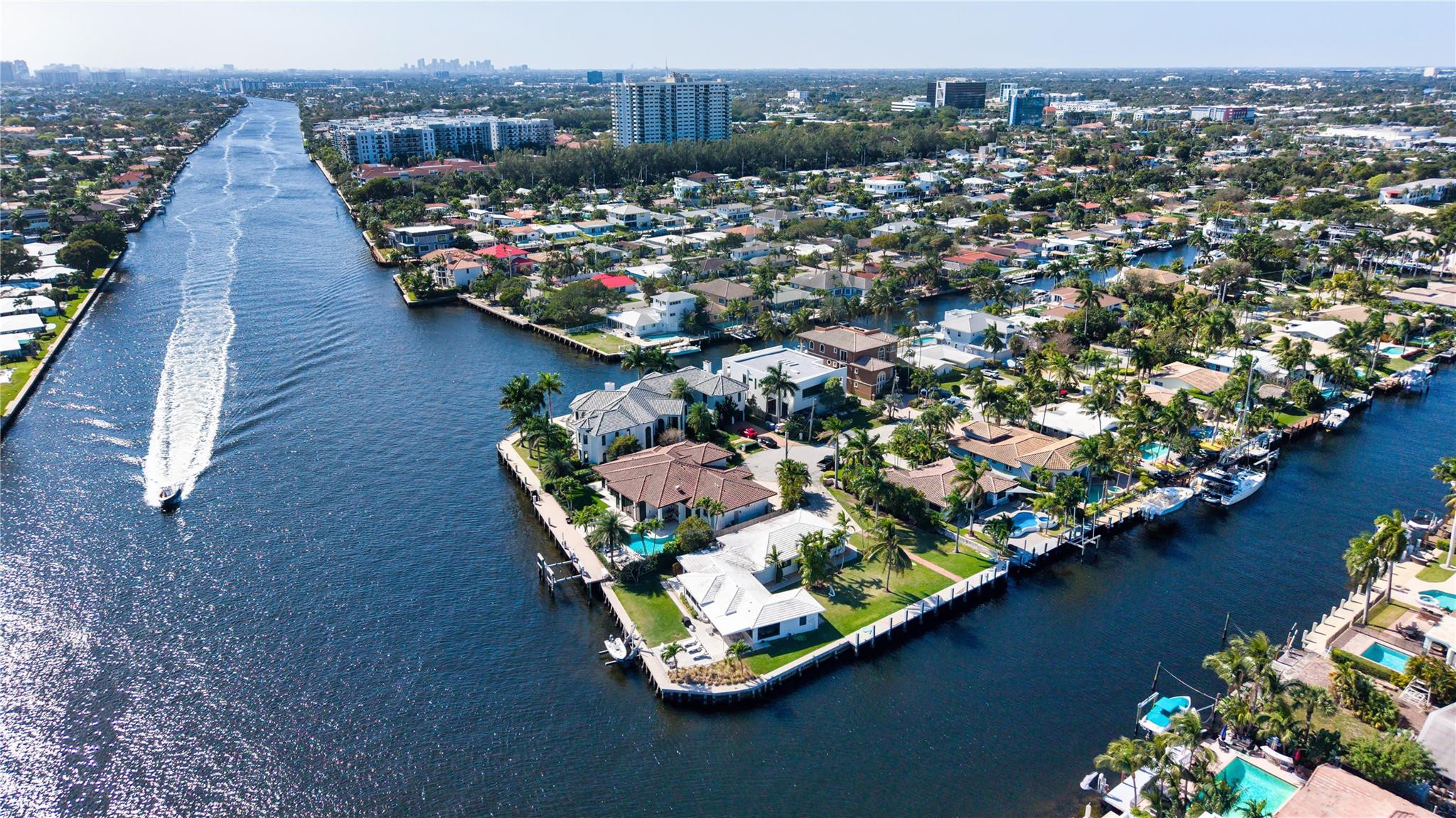 An exceptional .38-acre point lot boasting 260 +/- feet of wraparound waterfrontage capable of accommodating a large mega yacht. The renovated ranch-style residence offers immediate enjoyment or the perfect opportunity to build a custom waterfront estate in one of East Pompano Beach's most coveted locations. DISCLAIMER: Information published or otherwise provided by the listing company and its representatives including but not limited to prices, measurements, square footages, lot sizes, calculations, statistics, and videos are deemed reliable but are not guaranteed and are subject to errors, omissions or changes without notice. All such information should be independently verified by any prospective purchaser or seller. Parties should perform their own due diligence to verify such information prior to a sale or listing. Listing company expressly disclaims any warranty or representation regarding such information. Prices published are either list price, sold price, and/or last asking price. The listing company participates in the Multiple Listing Service and IDX. The properties published as listed and sold are not necessarily exclusive to listing company and may be listed or have sold with other members of the Multiple Listing Service. Transactions where listing company represented both buyers and sellers are calculated as two sales. “No payments made until title passes” Some affiliations may not be applicable to certain geographic areas. If your property is currently listed with another broker, please disregard any solicitation for services. Information published or otherwise provided by seller, listing company or its representatives is deemed reliable but are not guaranteed and subject to errors, omissions, or changes without notice. Copyright 2026 by the listing company. All Rights Reserved.