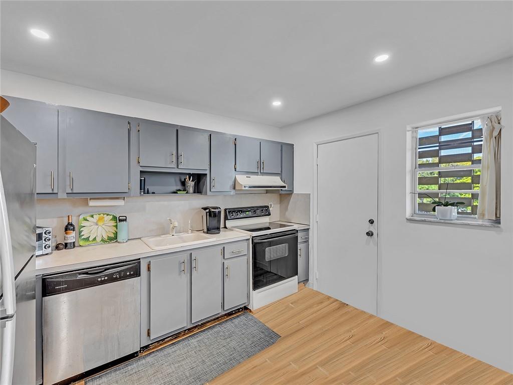 This bright and rarely available two-bedroom two-bathroom home offers a split bedroom floor plan with sweeping city, river, & pool views from your private screened-in balcony. Located on fourth floor in River Terrace with lovely wood plank porcelain tile flooring throughout entire unit and electric shutters for ease of ownership. Within the gated complex of River Shores, walking distance to all the action on Wilton Drive and Oakland Parks exciting downtown area. Resort style community with a large heated pool, clubhouse, gym, and tennis courts on 9 gorgeous acres of river front property. FREE boat dockage for owners with ocean access. You will love living here!