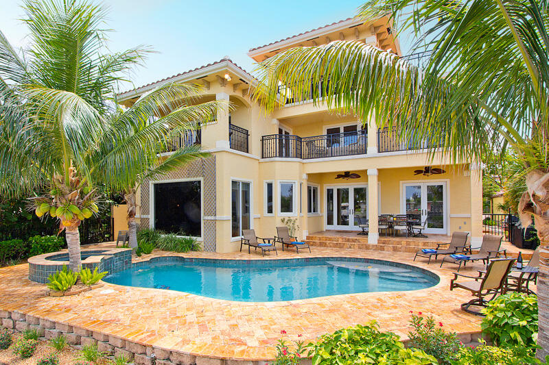 BEST DEAL ON THE INTRACOASTAL! If you are in the market for a waterfront home, this is a must see! This Waterfront Luxury Estate is a spectacular 5,600+ sq ft estate situated directly on the east, beachfront side of the iconic Intracoastal Waterway. This classic Mediterranean South Florida dream villa presents panoramic views and easy beach/water access in a setting that is lush and exclusive. 6 bedrooms and 4.5 bathrooms in a spacious 3-story design allows ample room and an inspiring sense of freedom and comfort. Luxury manor architectural touches include dramatic vaulted ceilings, gorgeous hardwood floors of genuine Brazilian cherry, and delightful crown molding. No fewer than 5 terraces throughout overlook the Intracoastal.

The master bedroom includes two of those scenic terraces, along with his-and-her walk-in closets and an ultimate luxury bathroom featuring Saturnia marble floors with mosaic accents, a whirlpool spa tub, a bidet, a walk-in shower, and dual toilets and sinks. On the third floor is an extra family/living room, which is perfect as a dedicated TV/Movie theater, or simply a great space for anyone who has kids that would love to have a separate playroom. 

The backyard area is designed to impress, including heated pool & spa, covered outdoor grill area, and spacious alfresco seating. A private dock provides convenient Intracoastal access. The rear entertaining area faces west and at the end of your day offers unobstructed sunset views that are gorgeous, romantic, and unforgettable.

Deerfield Beach is the epicenter of the active South Florida surf, sun & sand scene, including the best and friendliest local beach for surfing. Overall, it is just a fun and exciting neighborhood to live in that includes a fishing pier, a great beach with public volleyball courts, fine dining with waterfront restaurants, cafes, shops, scuba & snorkeling, and watercraft rentals. So, come on down and check this luxury waterfront home in one of South Florida's great neighborhoods.