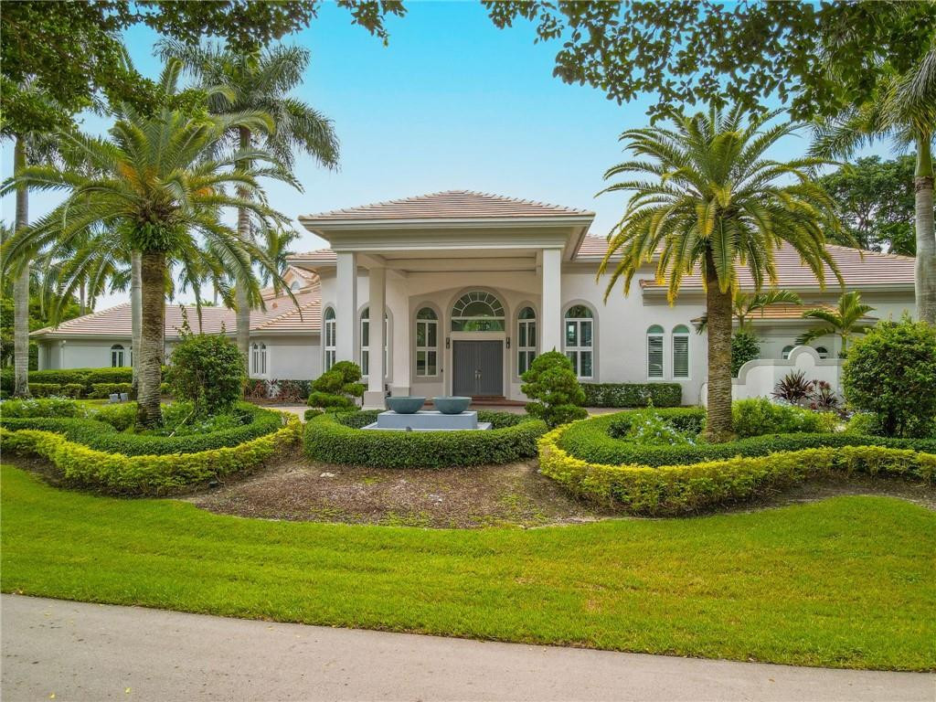 This stunning 1.4 Acre estate in the most sought after, guard gated Windmill Ranch Estates features 6 bedrooms, 8.5 bathrooms, Home Theater, Billiard Room, and office. A drive up to the circular, elevated driveway towards the double porte-cochere entrance will peak your interests the second you see it. As you open the front door, the open and bright living room invites you in, with 20ft ceilings that extend to the dinning room, and incredible outdoor and lake view. Completely remodeled, this is a must see. Gourmet kitchen, welcoming family room, double-sided fireplace + bar, this home is made to entertain with its resort-style backyard, sunken outdoor kitchen, and fully tiled swimming pool.4 car garage.Reverse Osmosis water filtration servicing the entire home. Newer Roof and so much more!