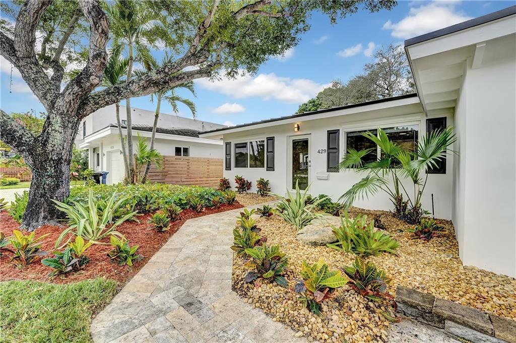 Modern beach style living meets traditional-historic character in this 1956 home that’s been fully updated to 2022 standards, a true gem in the highly sought after neighborhood of Victoria Park. This 3 bedroom 2 bath single family home offers white kitchen cabinetry with quartz countertops and stainless steel appliances, light porcelain imported  tile floors throughout, hurricane impact windows and doors, brand new metal roof, LED lighting and more. Boasting room to roam with an oversized fully fenced back yard with screened in lanai, lush landscaping, and new widened multi car driveway constructed with the finest in silver tone authentic travertine stone. No HOA. Walk to Las Olas, bike to the beach. The opportunities are endless at 429 NE 14th Avenue. Open house 1/15 & 1/16 12pm-3pm.