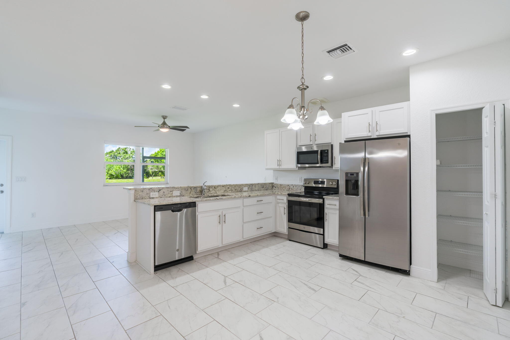 Tucked inside River Place community, this 2-bedroom, 3-bath residence delivers a clean, contemporary feel,newly built in 2019. Overlooking the water, the home features a screened-in lanai with western exposure—perfect for catching evening sunsets. Inside, you'll find a light-filled, open layout designed for comfort and efficiency, helping keep monthly electric costs low. The property is equipped with hurricane-impact windows and doors, along with updated roof, appliances, and major systems all from the original build year. Additional features are a private garage, added storage space, and ready for immediate occupancy. The monthly HOA, around $320, provides access to community perks like a swimming pool, clubhouse, fitness center, and a shared dock for enjoying the waterfront lifestyle.  Seller offering a $5,000 credit at closing for a legitimate offer.