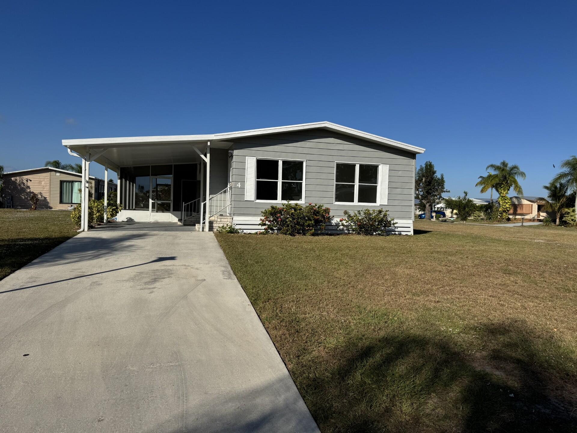 Beautifully updated home, with a brand new roof located on a quiet cul-de-sac in a vibrant 55+ community! This park-owned property offers exceptionally low lot rent at just $599/month, making it one of the best values in the area. Inside, enjoy brand-new appliances, modern laminate flooring, and fresh interior paint for a bright, move-in-ready feel. A freshly painted screened room and exterior storage area add extra convenience and comfort. The community is packed with amenities, including free golf, multiple pools, tennis, pickleball, bocce, shuffleboard, a workshop, and so much more. Trash and recycling services are also included. Don't miss this affordable, beautifully updated home with incredible amenities in a fantastic 55+ neighborhood!