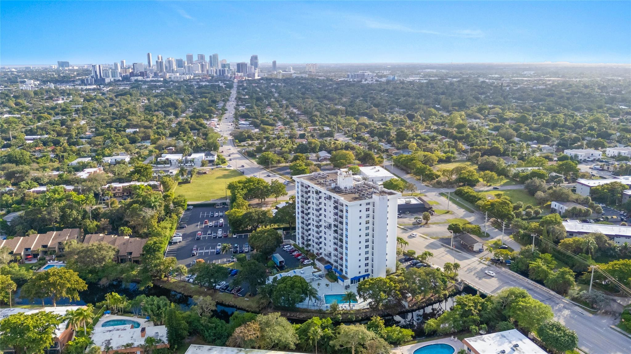 This beautifully renovated condo offers sunset views & a bright, open layout. The kitchen is open to the living area, creating a seamless living space. Full renovation incl. new electric panel, impact windows & doors, and new AC installed in 2025. Consistent tile flooring runs throughout the unit and 1/2 bath adds extra convenience. Amenities incl: Gated parking lot, heated pool, grill area,car-wash station, and bike storage. Cable TV and high-speed fiber-optic internet included in condo fee. A complimentary laundry room is located just across the hall. One small PET is welcome! Newly renovated lobby, community room, and updated elevators. Walk to Wilton Drive Restaurants & Entertainment.