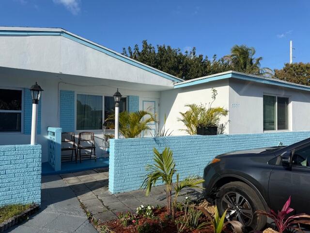 Charming 2-bedroom, 1-bath townhouse located in the Gramercy Park community of West Palm Beach. This single-story home offers approximately 740 sq ft of living space with tile flooring throughout, central A/C, and an eat-in kitchen with spaces cabinets, countertops, and appliances. The property features hurricane impact windows, an indoor laundry area, and a private fenced backyard with a covered porch and storage shed. Situated on a nearly 4,000 sq ft lot with driveway parking and no HOA restrictions. Conveniently located near shopping, dining, major highways, the Ballpark of the Palm Beaches, Palm Beach International Airport, and just a short drive to the beach. Great opportunity for a first-time homebuyer or investment property