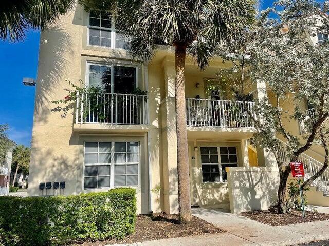 Heart of abacoa with the back porch with view of baseball stadium. Two bedroom two bath first floor unit.  Laminate floors, covered front entrance, covered fenced back patio, washer/dryer with one parking space included.  Community pool and amenities.  Walk to restaurants, stores, ball games, concerts and more right out your back door.  Parking garage across street for easy additional parking during the day.